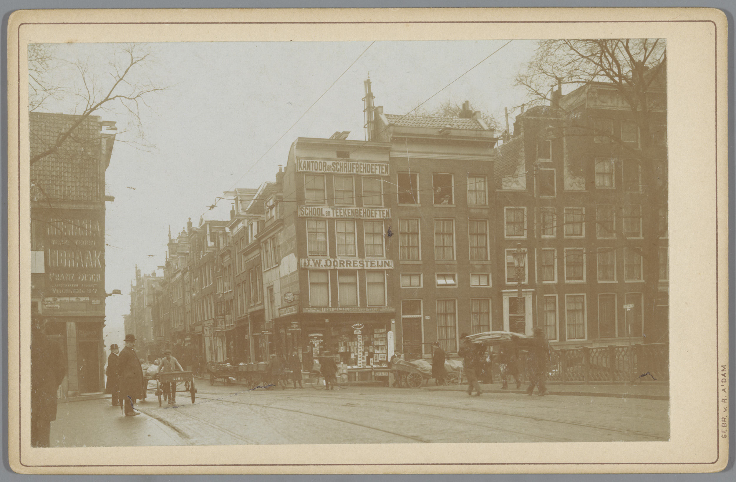 Landscape photograph by Gebr. van R. showing Amsterdam street with sunlight and cobblestones.