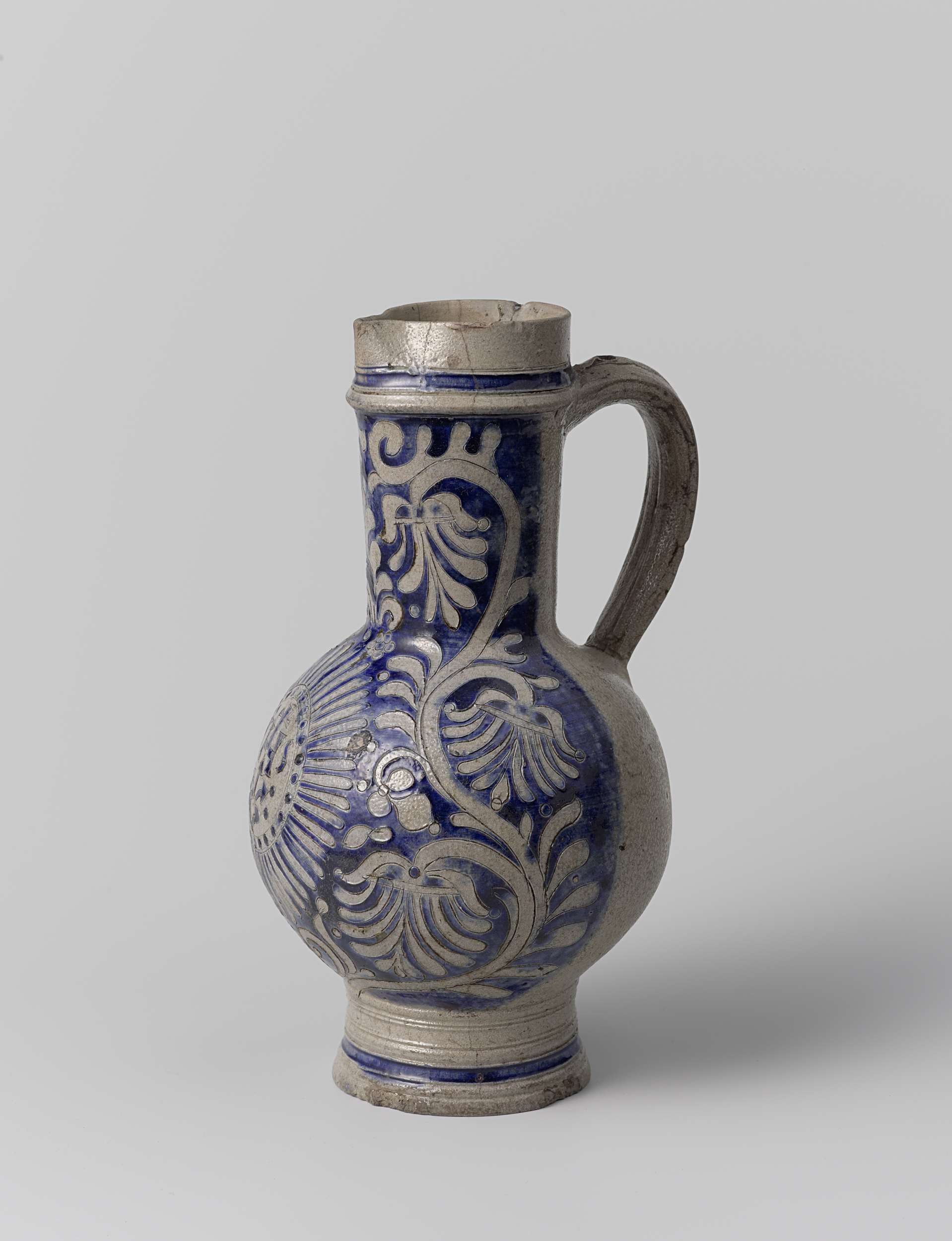 Ceramic jug with 'IHS' and floral scrolls by unknown artist