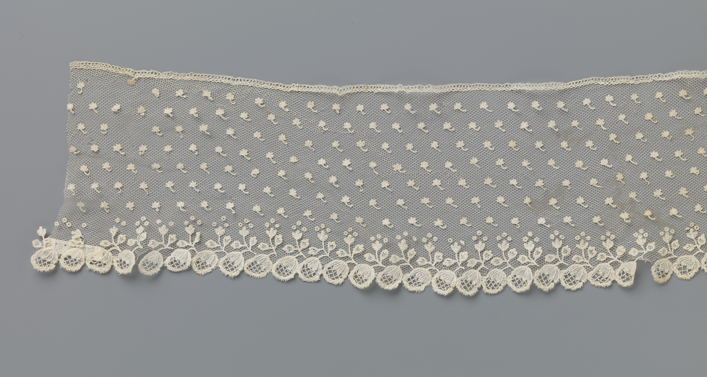 Lace piece with floral border by Unknown Artist
