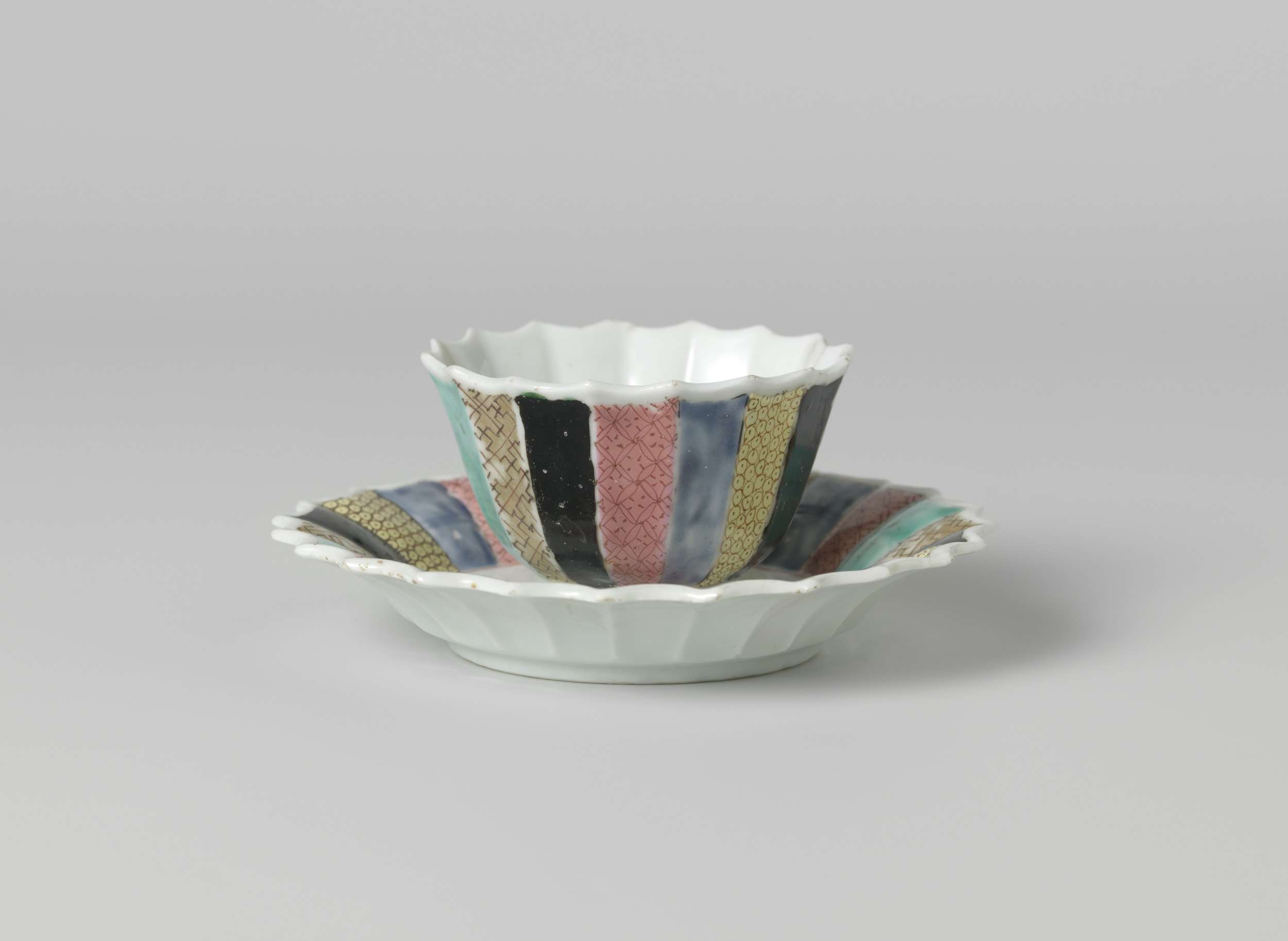Bell-shaped cup and saucer with a woman in a garden, unknown artist