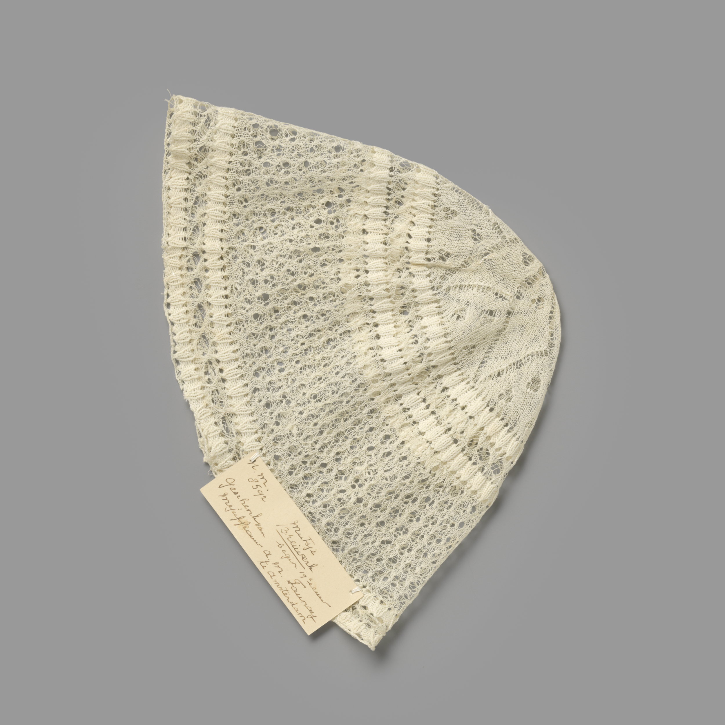 Textile child's cap featuring a flower motif by Unknown Artist