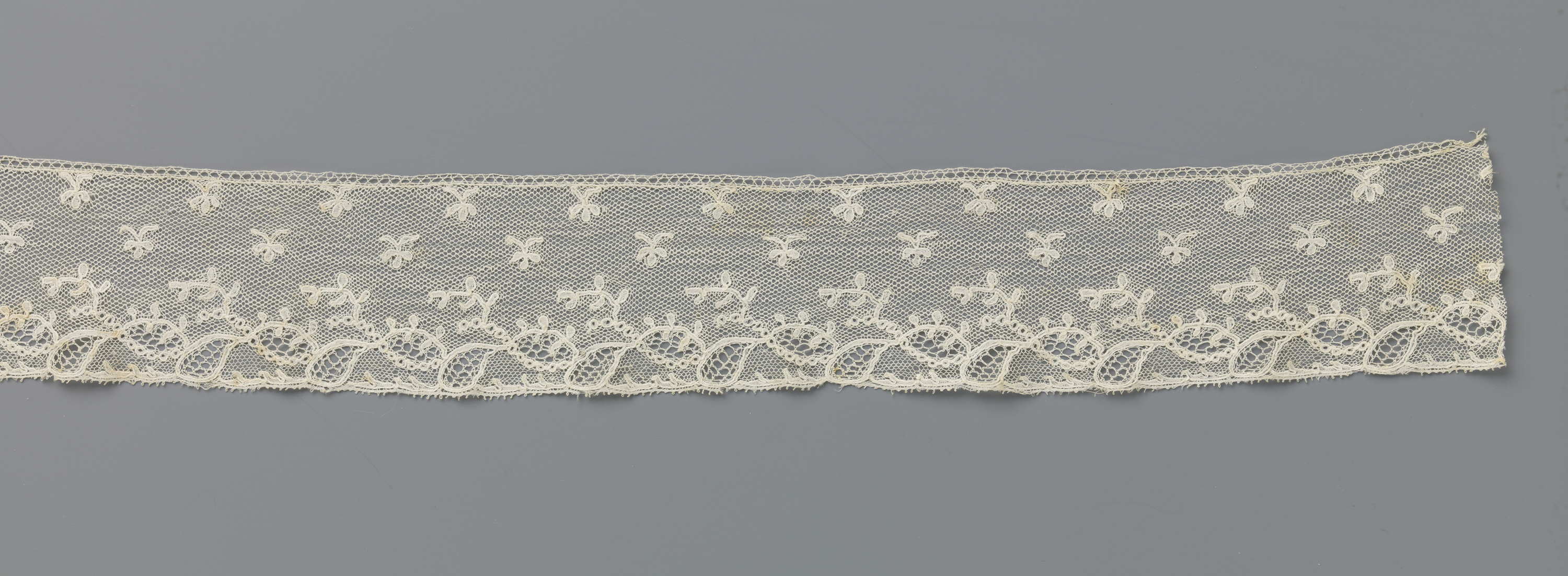 Lace artwork by Unknown Artist featuring intricate patterns and textures.