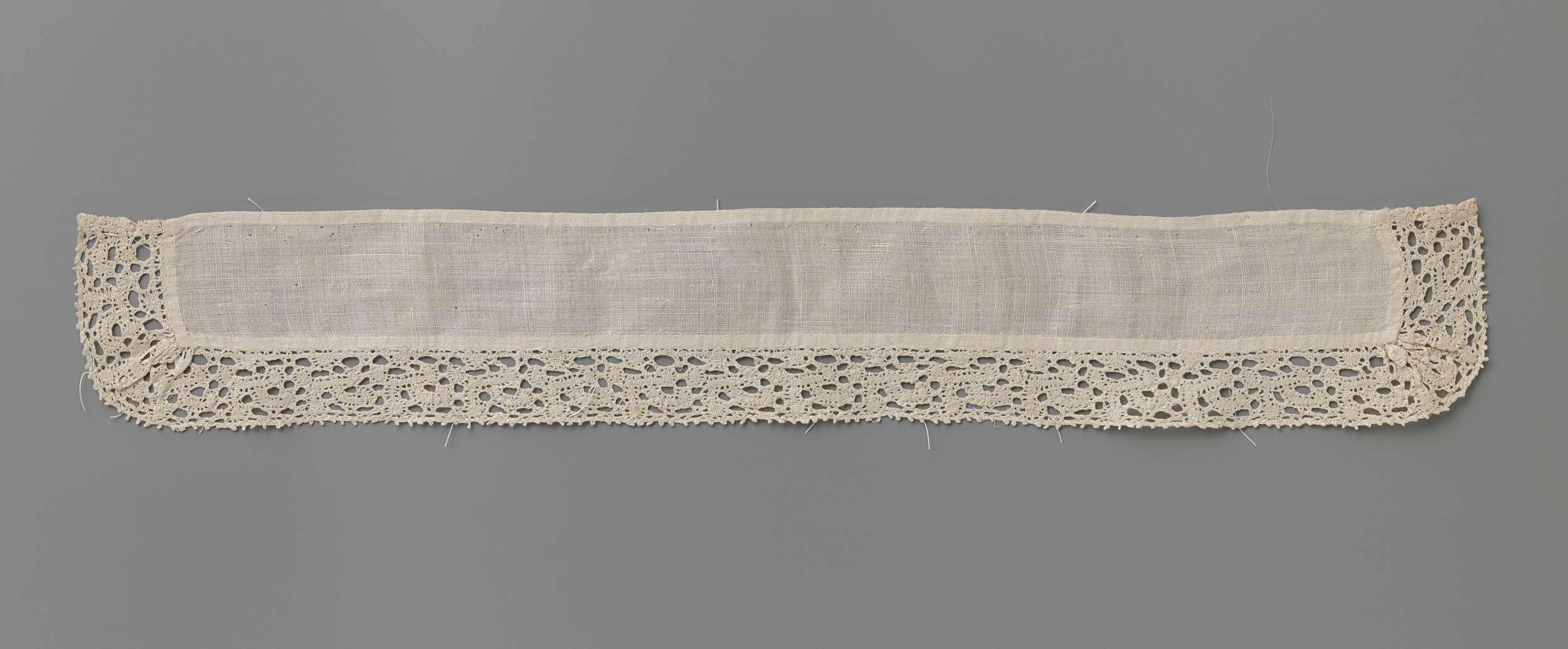 Lacework featuring buttons around a rectangular linen piece by Unknown Artist