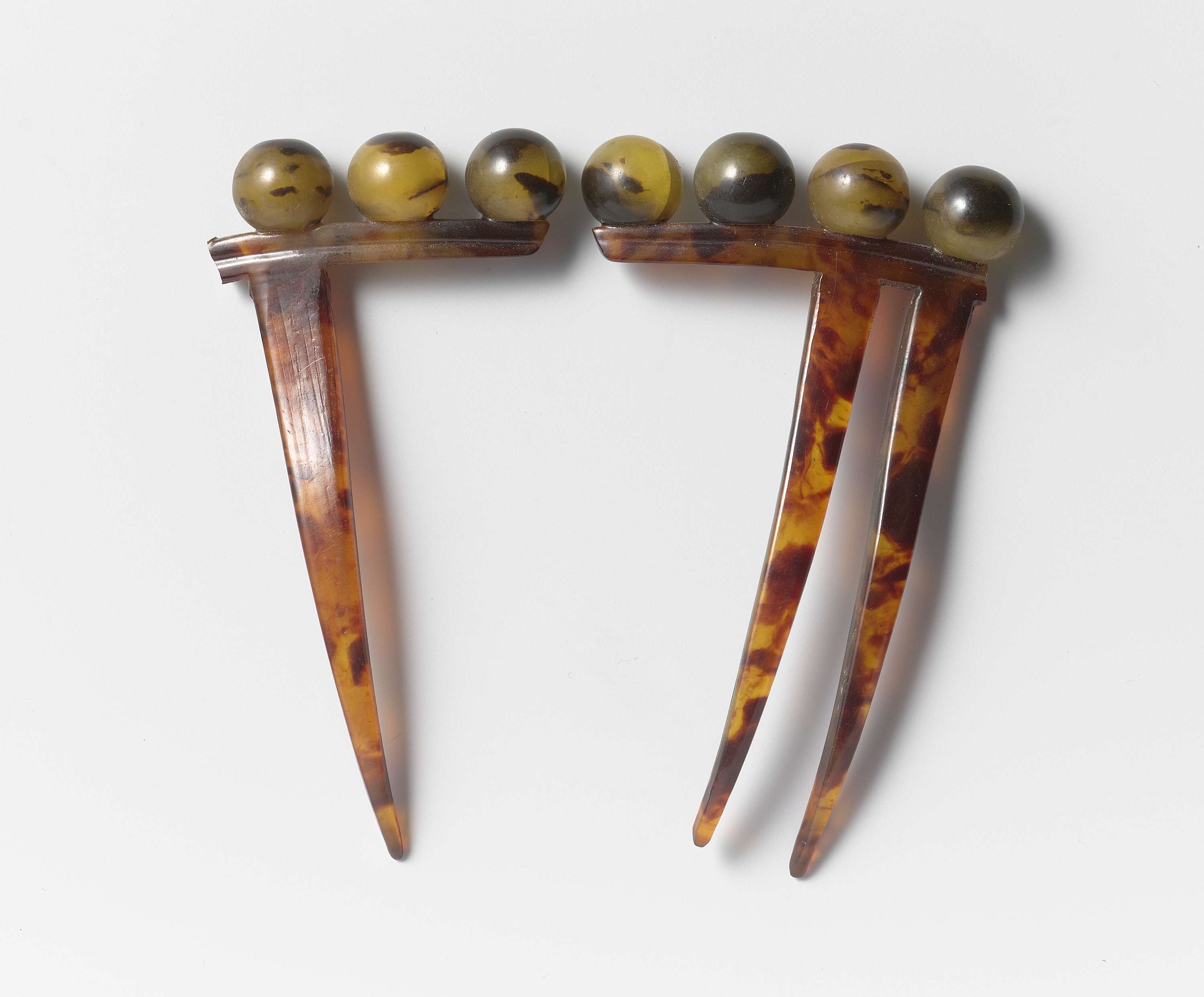 Victorian decorative hair comb made of imitation tortoiseshell by Unknown Artist