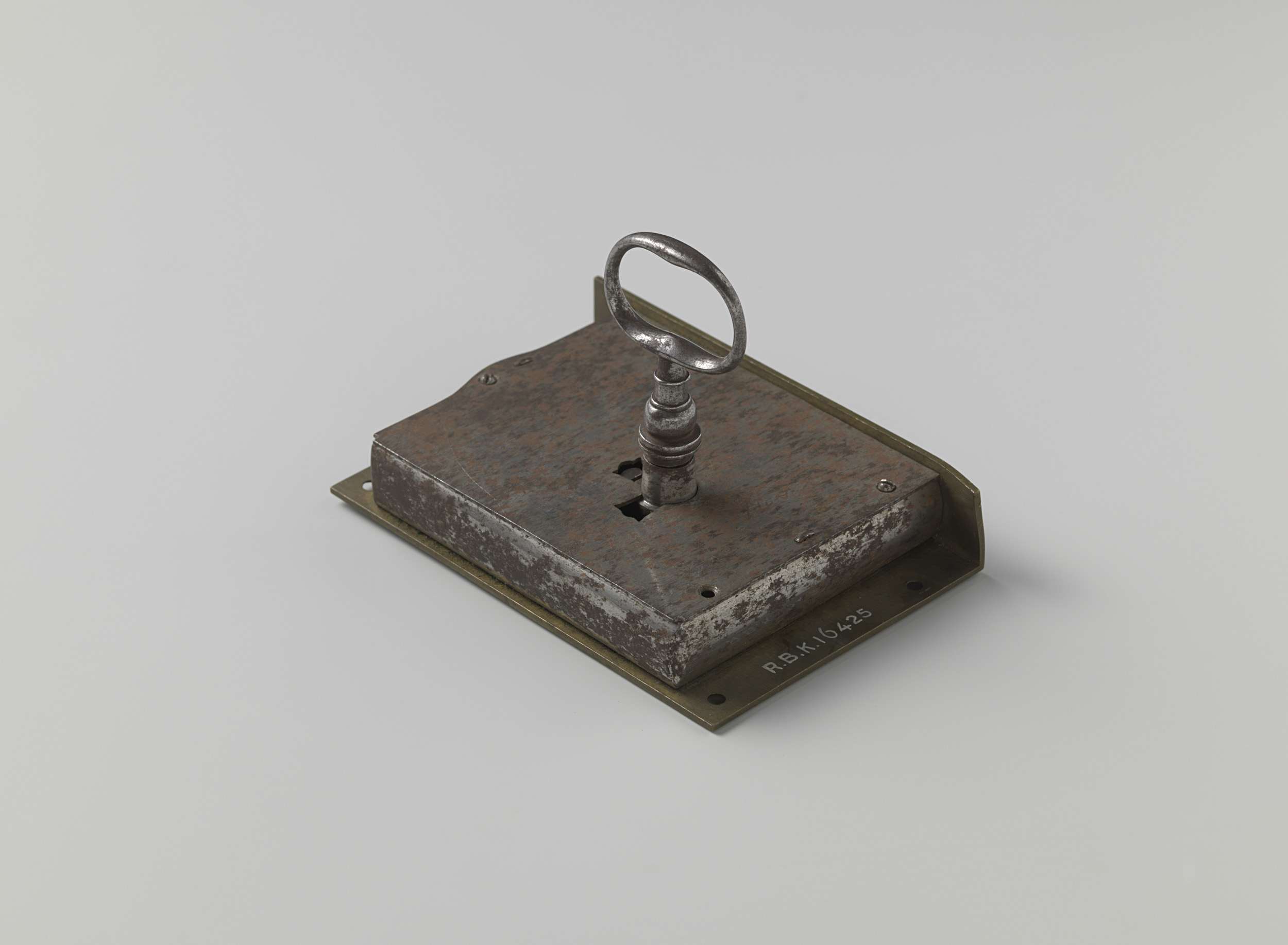 Decorative metal lock by anoniem, showcasing intricate design details.