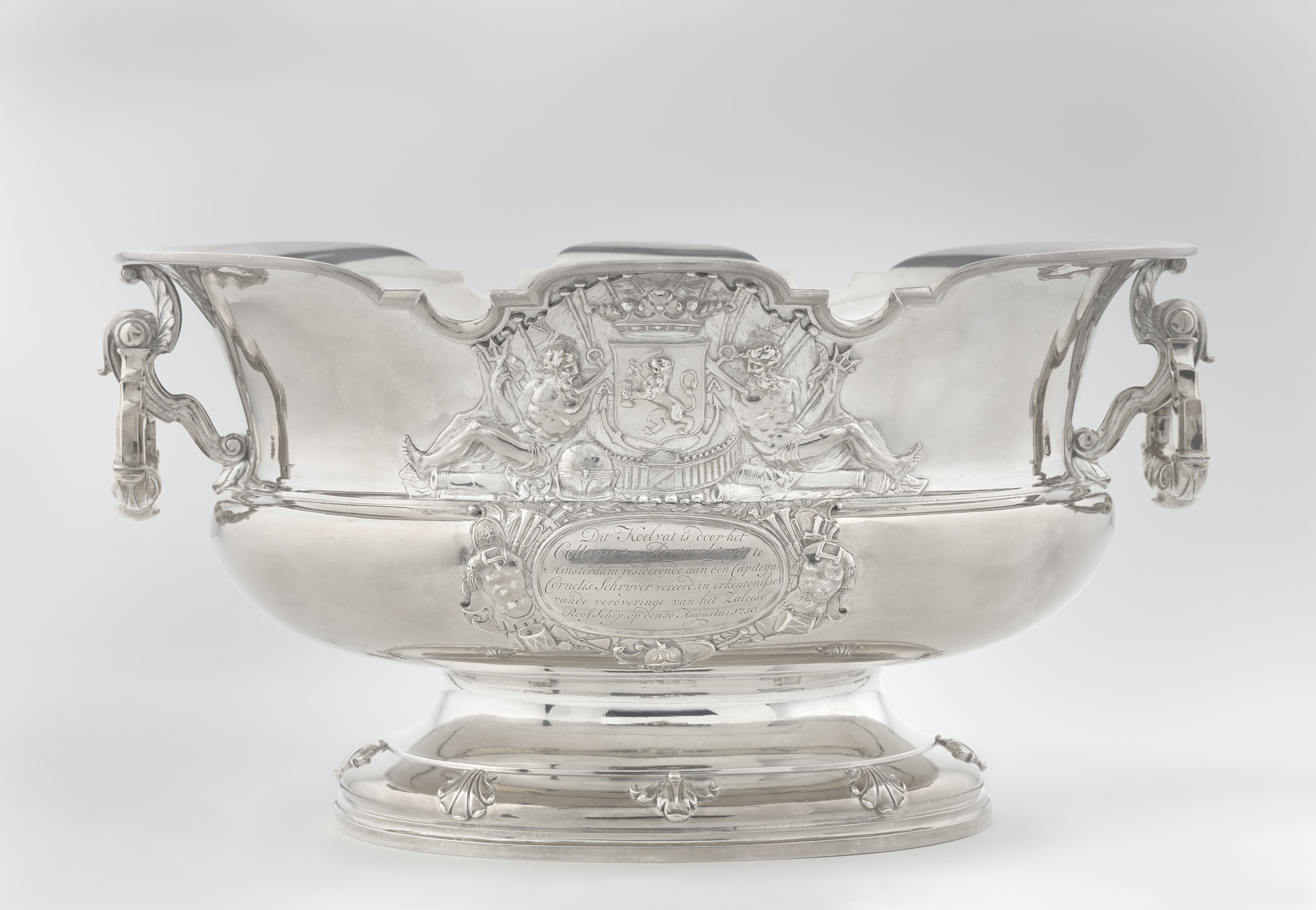 Wine fountain and cooler in metal by Alger Mensma, showcasing decorative elements and naval motifs.