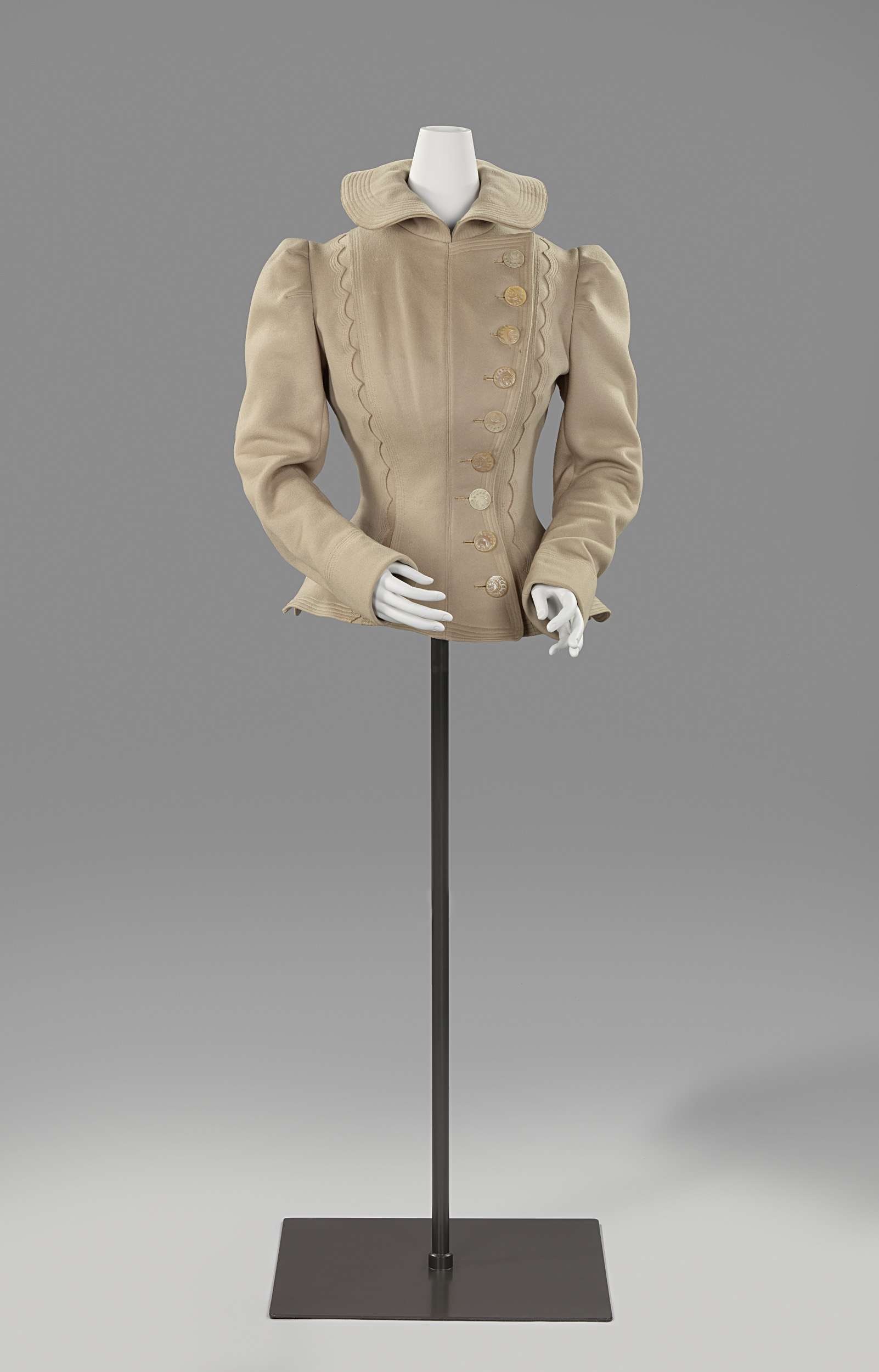 Victorian cycling jacket made of wool, featuring intricate stitching by an unknown artist.