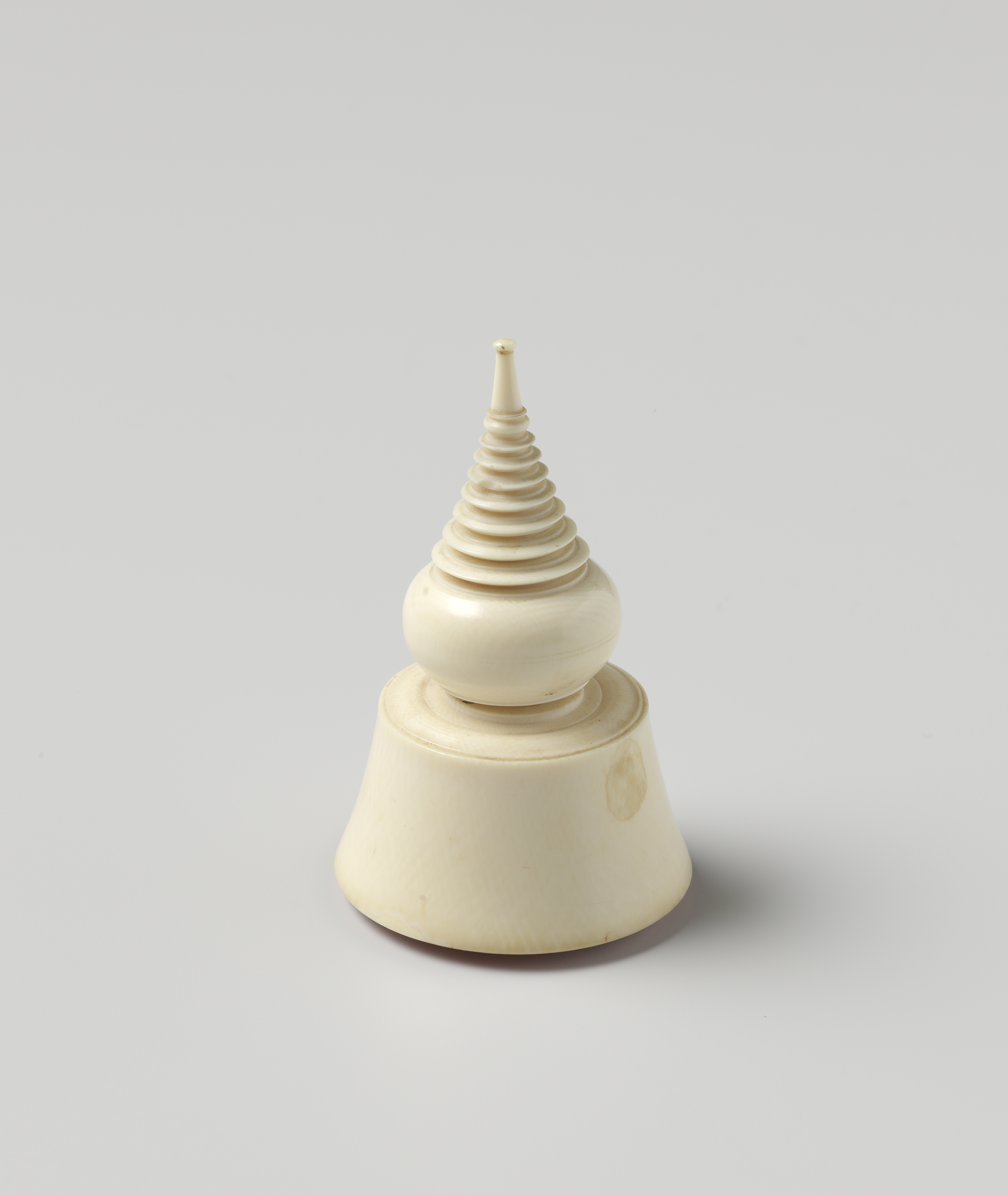 Figurative ivory sculpture by Unknown Artist depicting a contemplative figure in earthy tones.