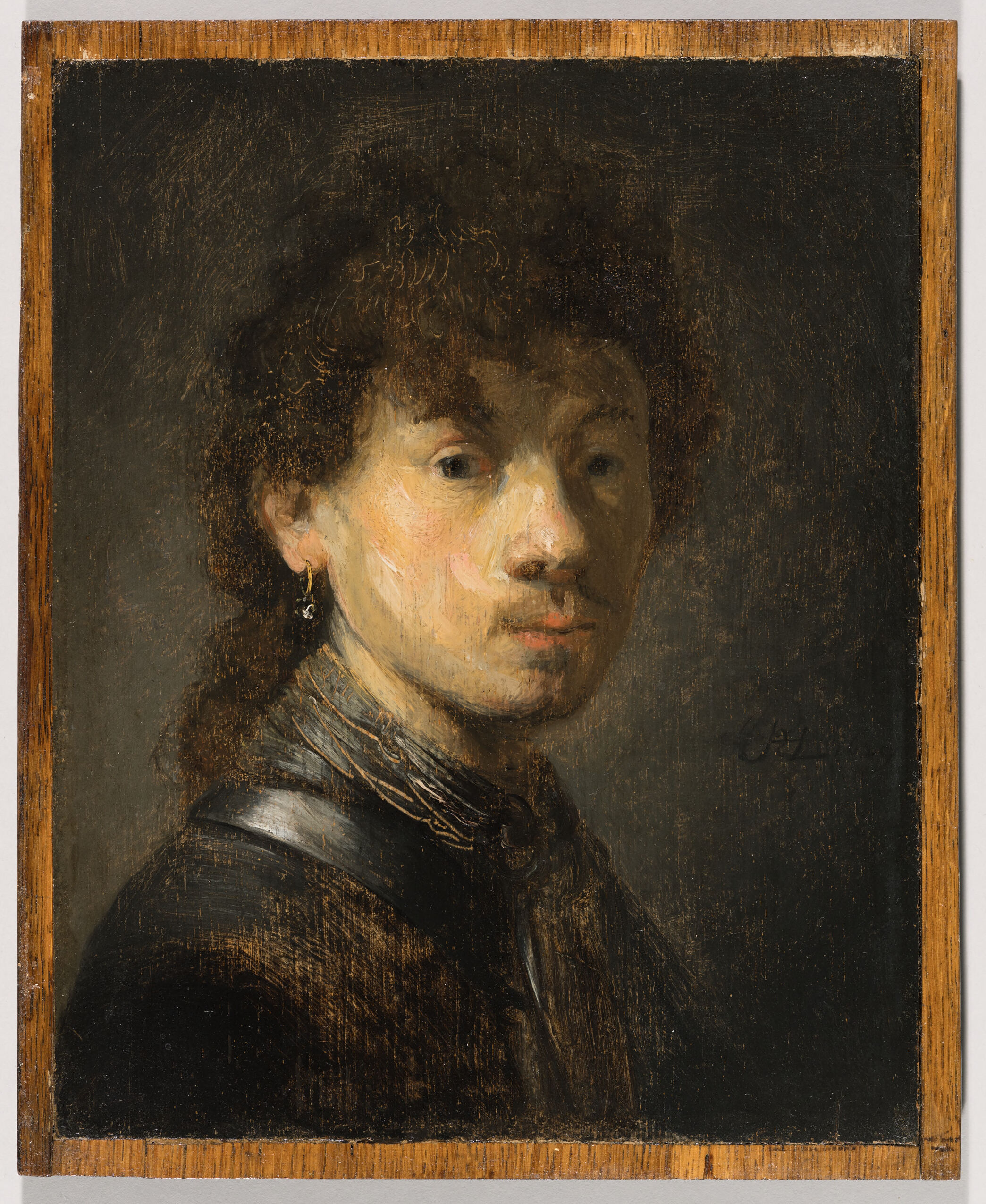 Bust of a young man in oak by Rembrandt Harmensz. van Rijn