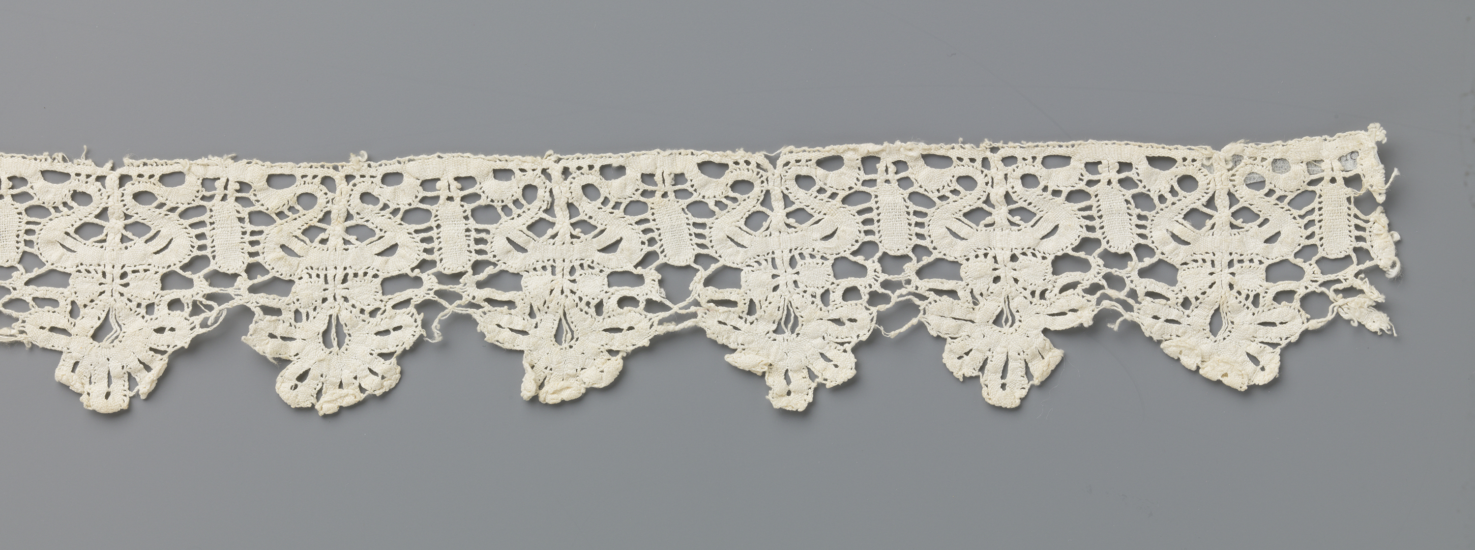 Lace work with floral design in a vase by Unknown Artist