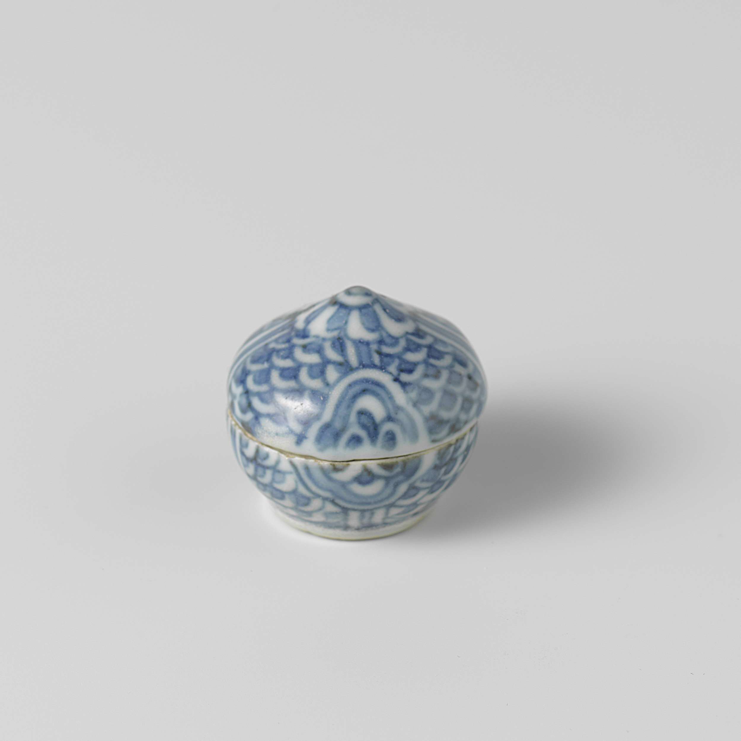 Ceramic round box with wave pattern and blossoms by unknown artist