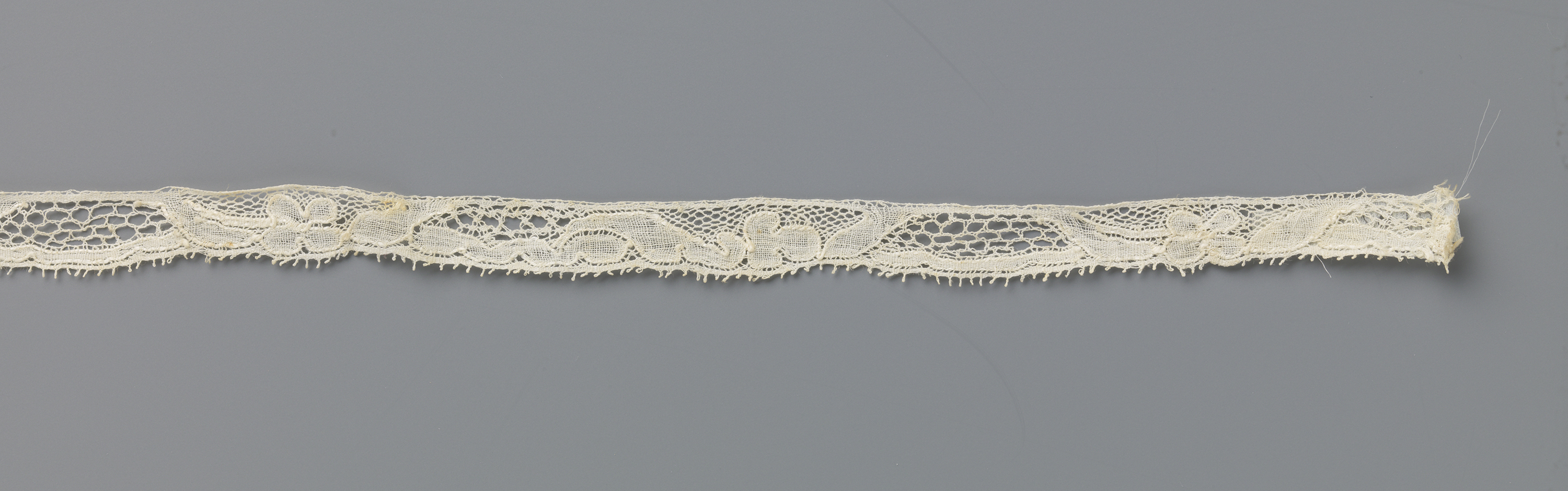 Lace artwork by Unknown Artist featuring intricate patterns and a trapezium cartouche