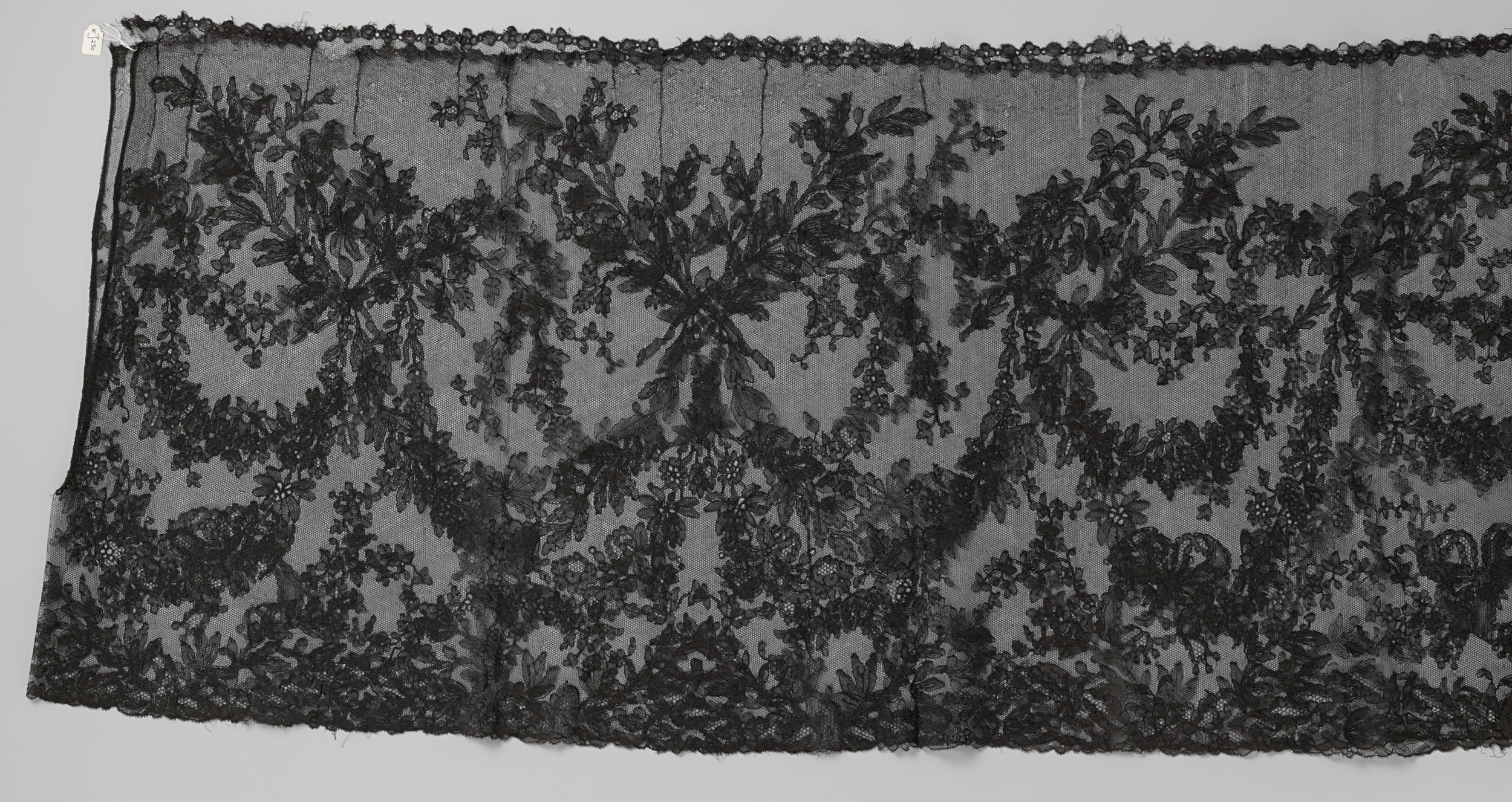 Lace work featuring a thin flower garland by Unknown Artist
