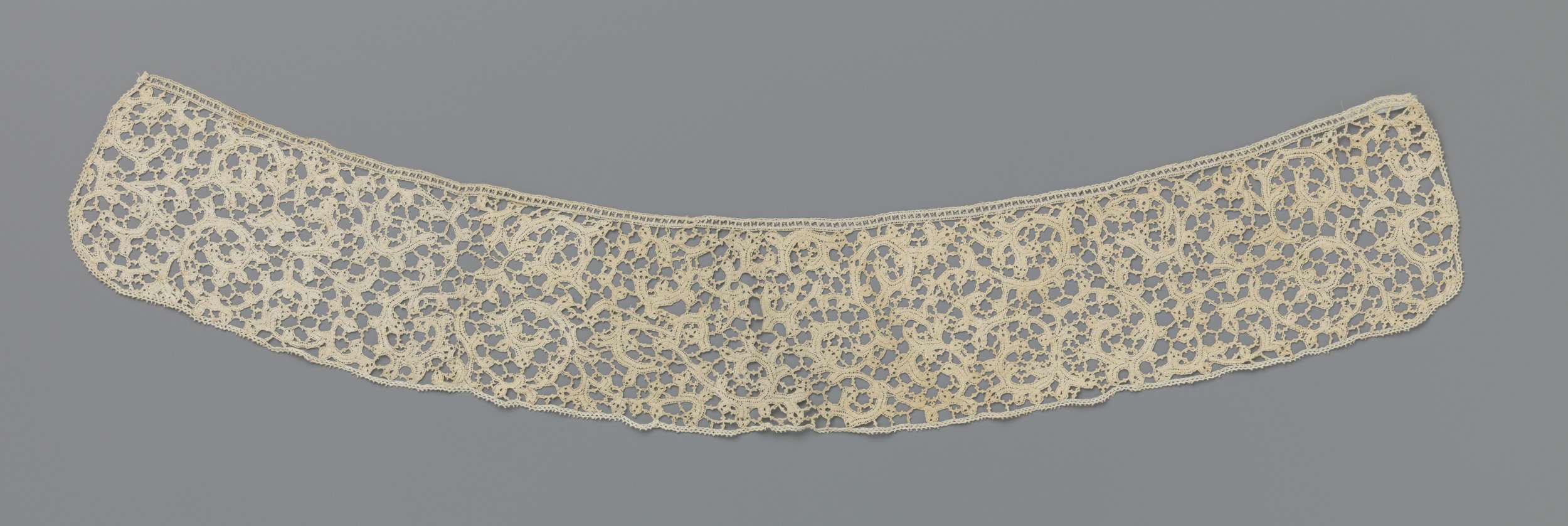 Lace work by Unknown Artist, featuring intricate filigree patterns.