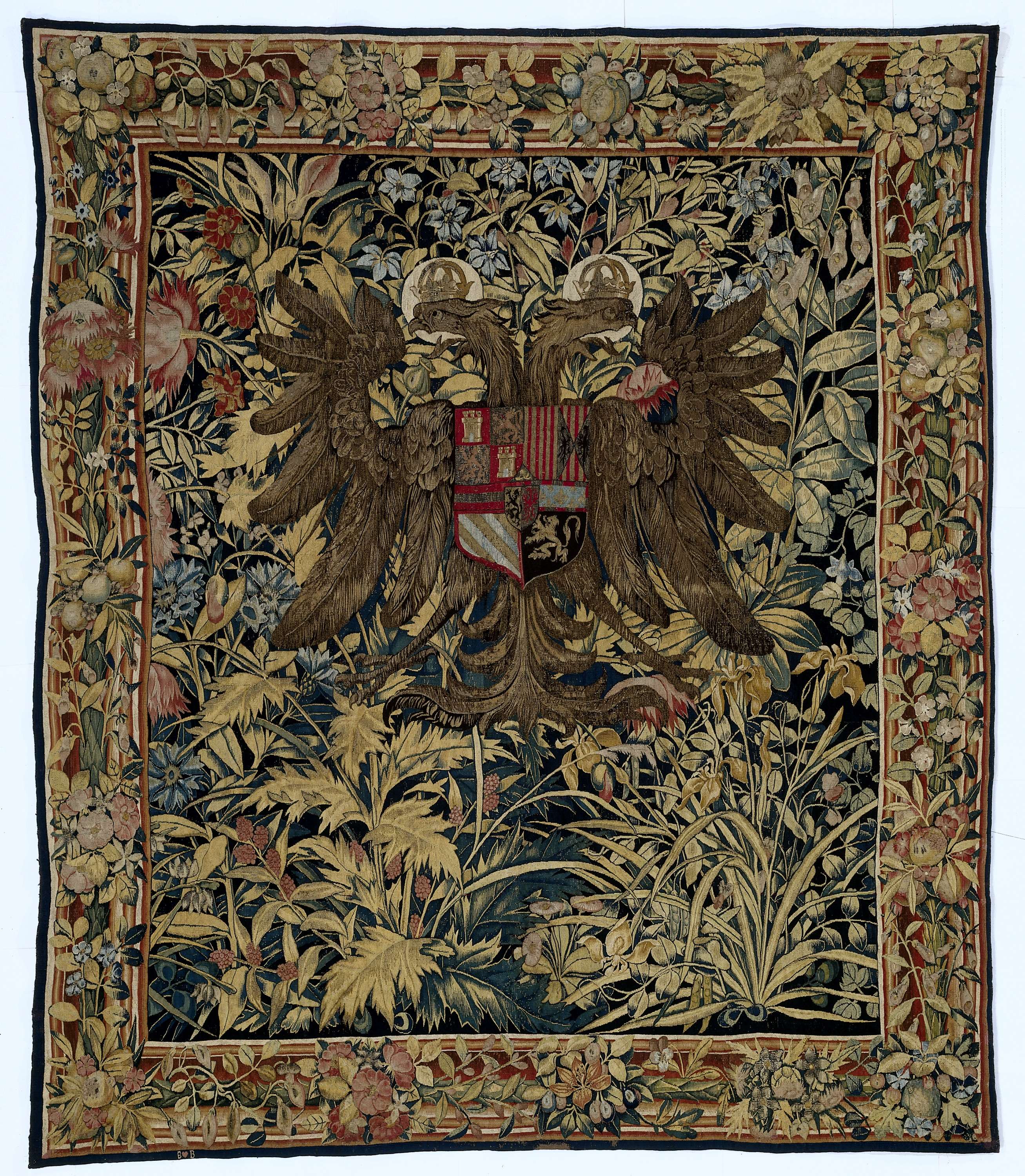 Tapestry by Willem de Pannemaker featuring a crowned double-headed eagle and flowers