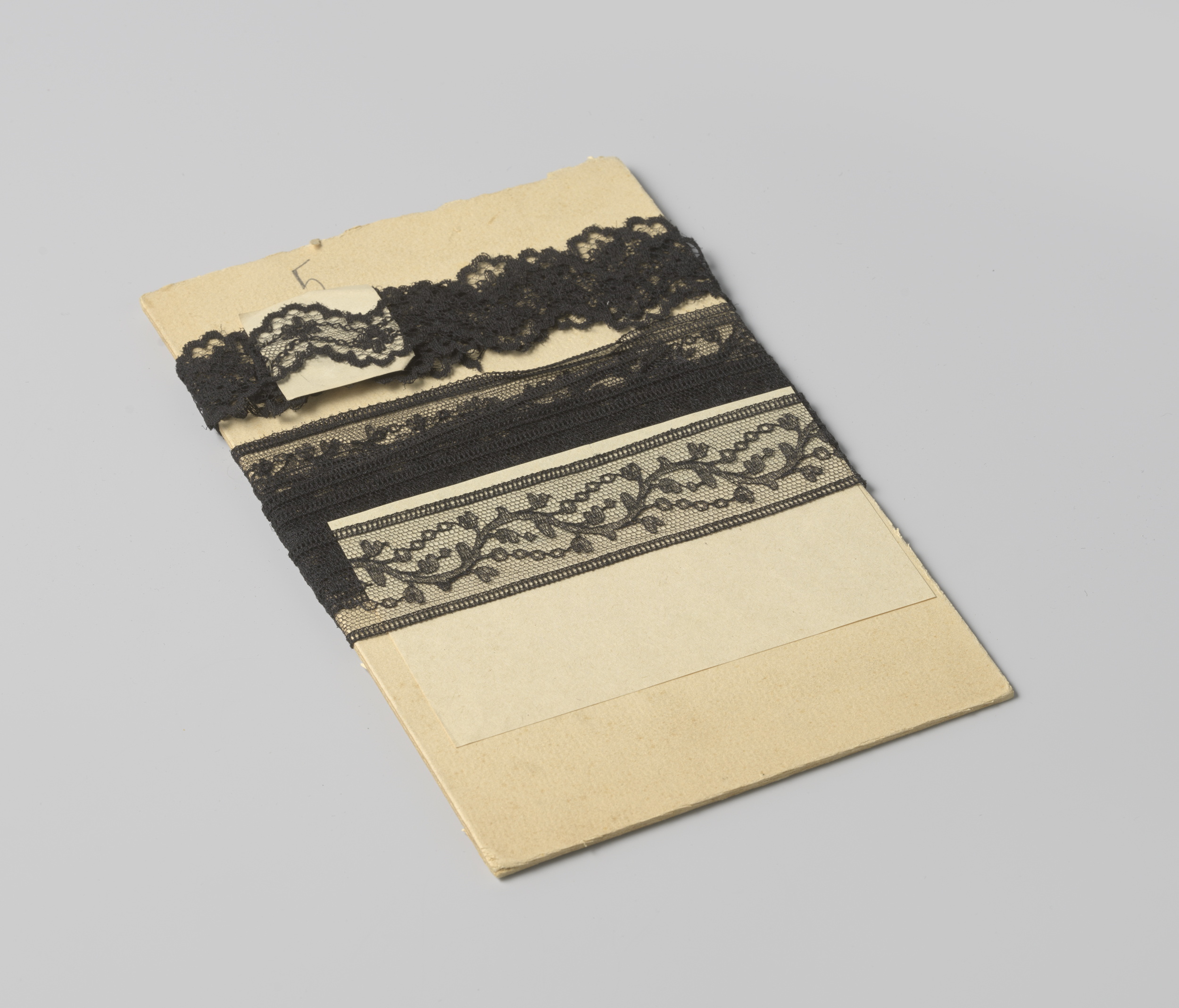 Decorative art featuring a black lace motif by Gustav Schnitzler