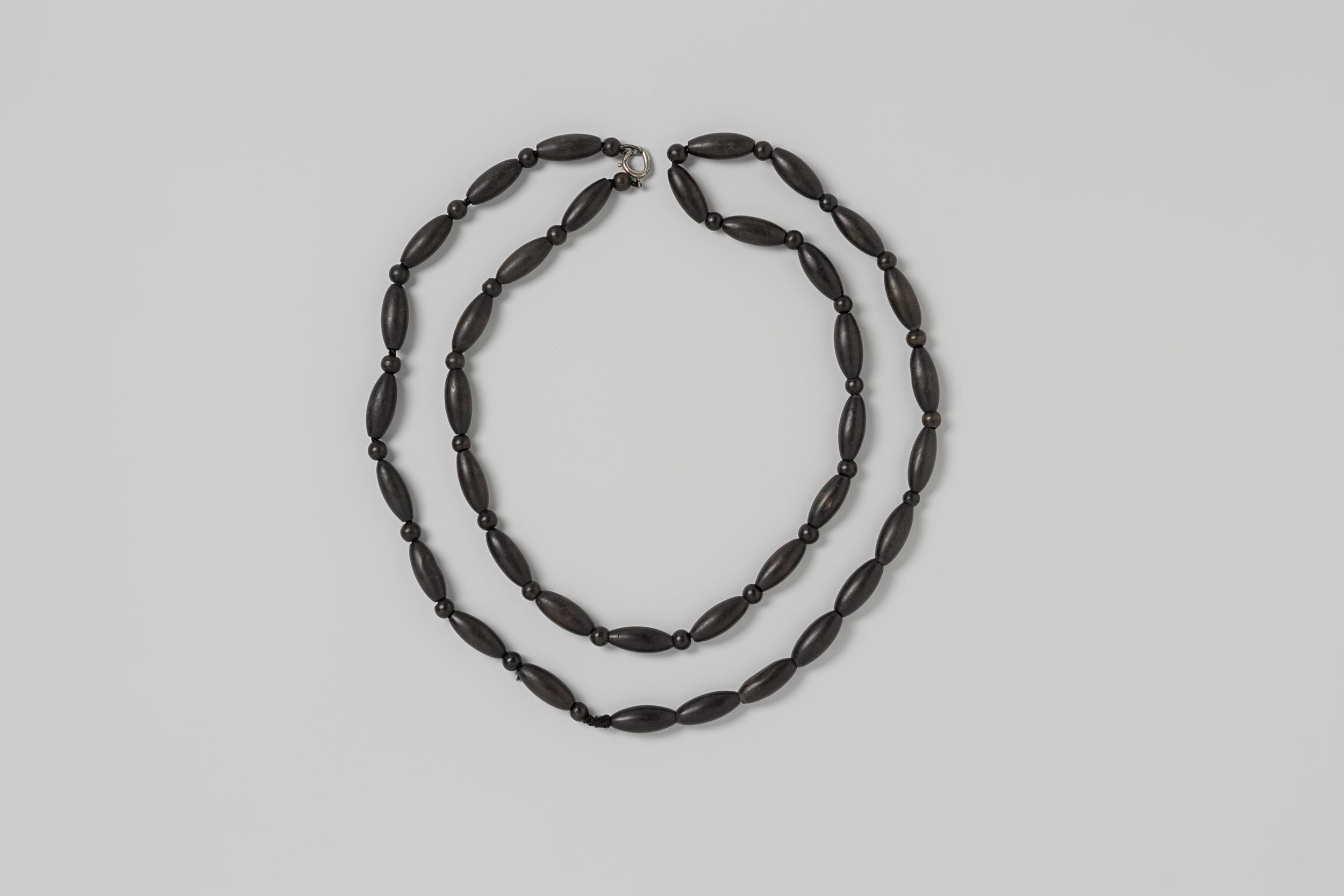 Decorative art necklace made of black wooden beads by Unknown Artist