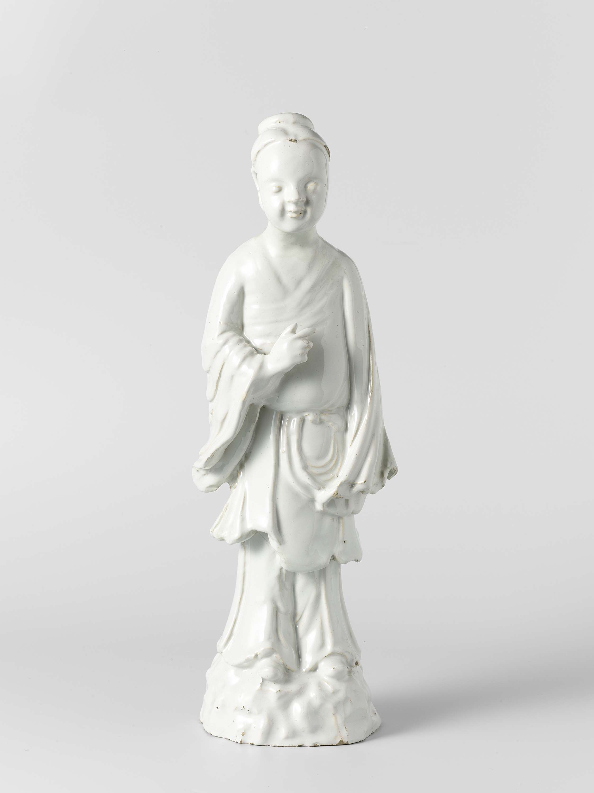 Porcelain figure by unknown artist, featuring delicate curves and unadorned surfaces.