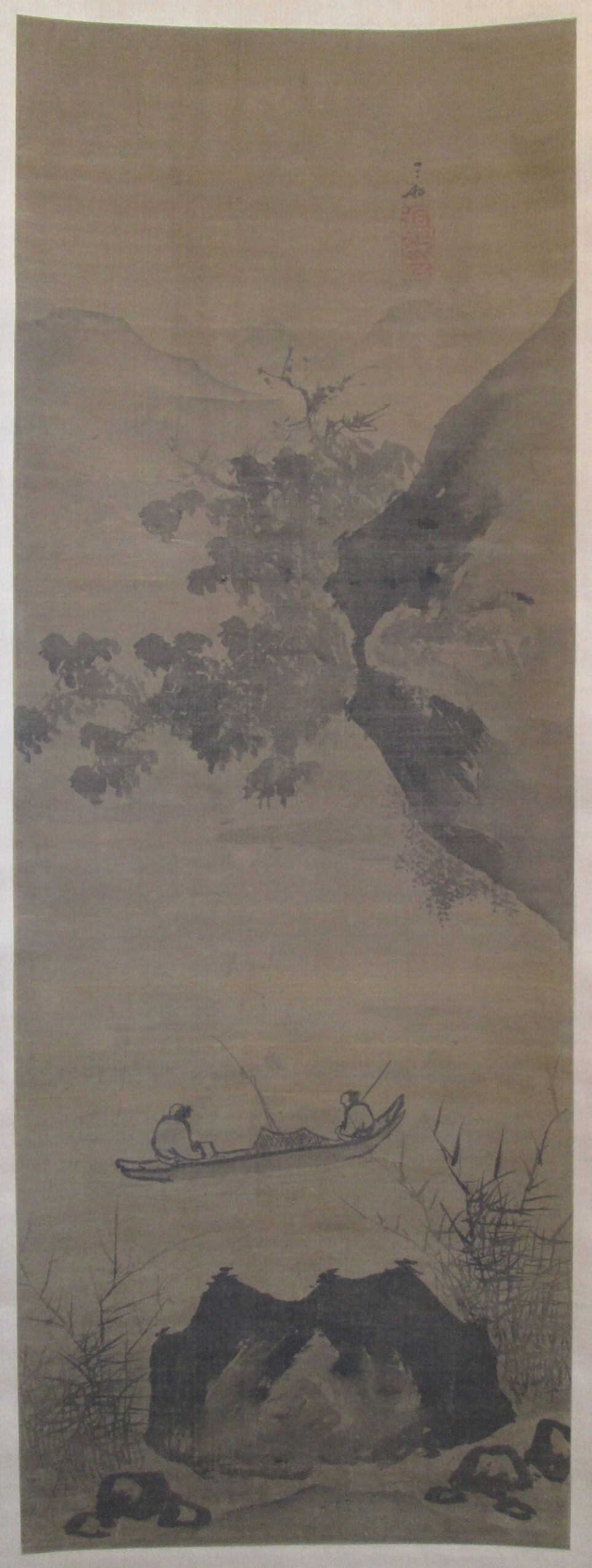 Fisherman in a boat under a cliff, ink on silk by Jiang Song