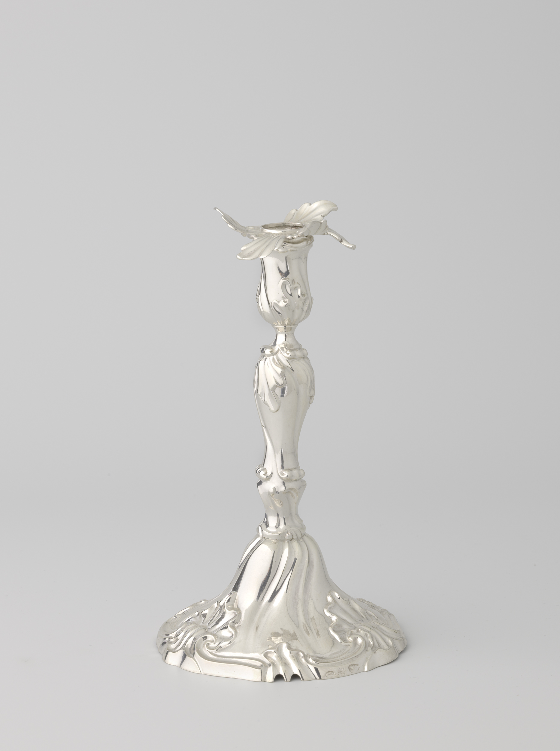 Silver candelabrum by Cornelius Wilhelmus Rensing, metal medium, highlighting intricate details and soft light.