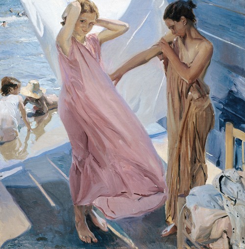 A woman is seen drying herself after bathing, surrounded by soft fabrics and warm light.