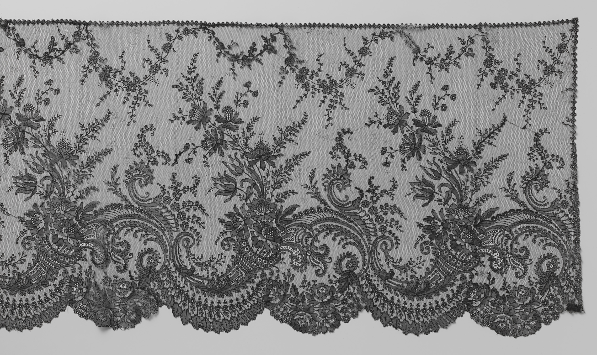Delicate lace work by Unknown Artist, c. 1850-1860, showcasing intricate patterns and textures.