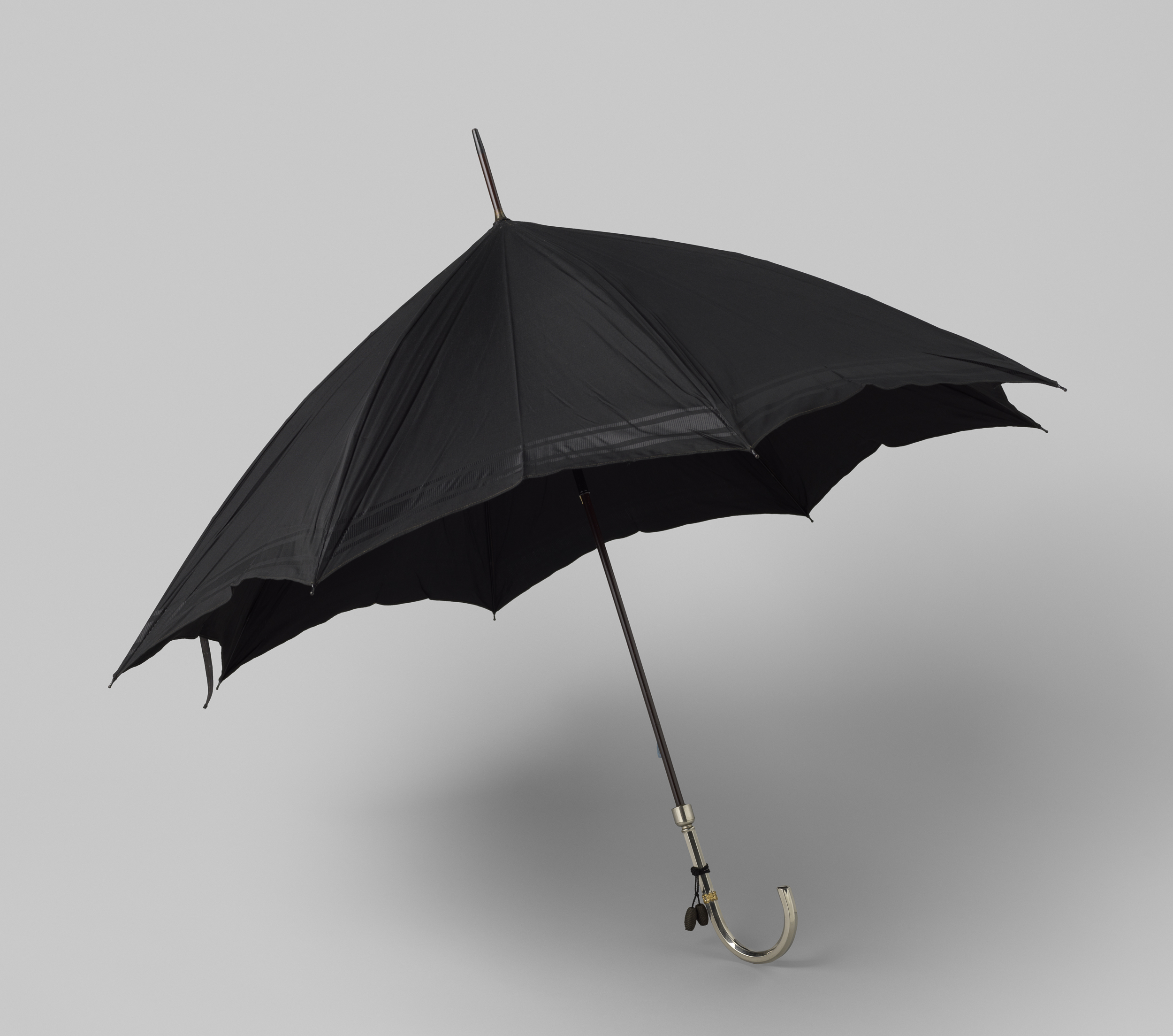 Decorative art of a black silk umbrella by Gustav Schnitzler