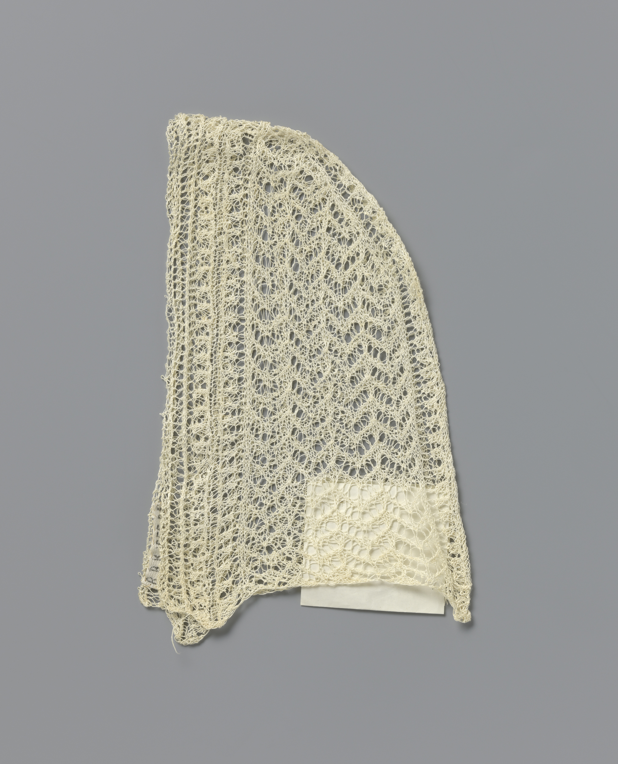 Textile piece made of cotton by Unknown Artist featuring intricate openwork stitches.