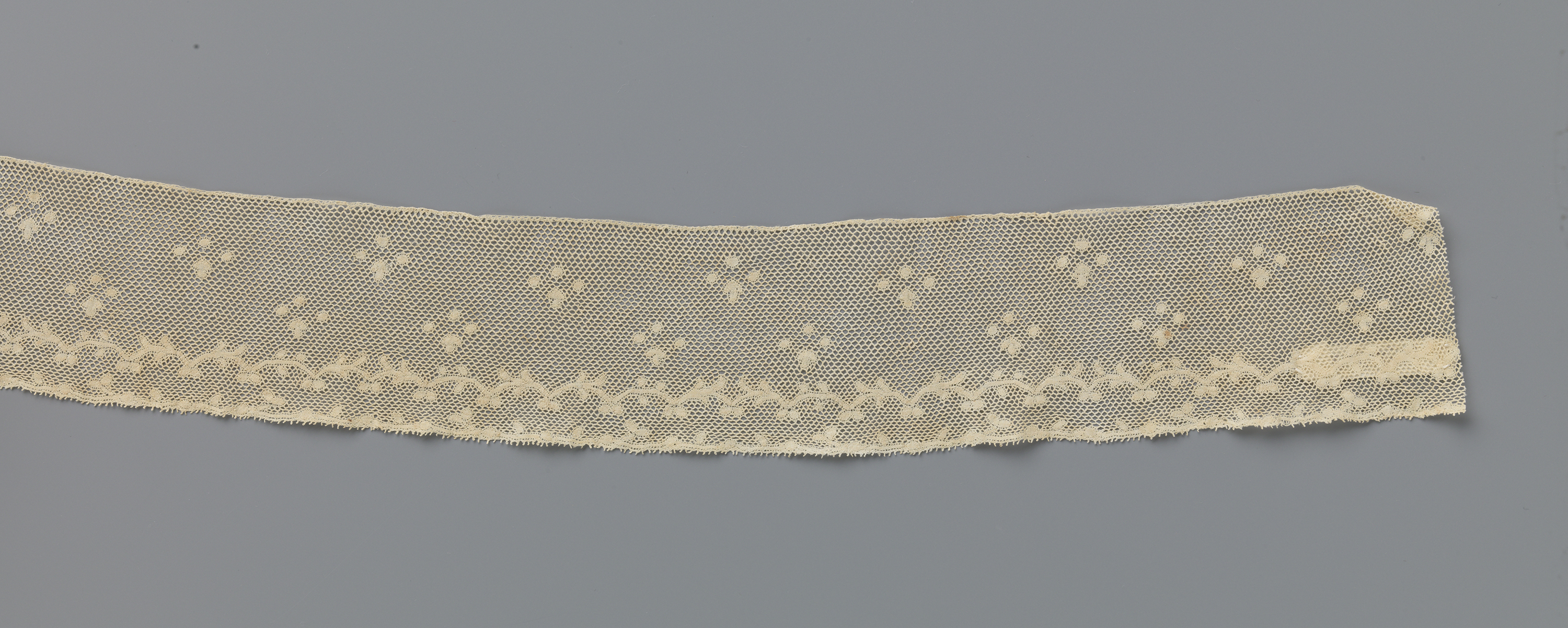 Delicate lacework with leaf patterns and gold accents by Unknown Artist