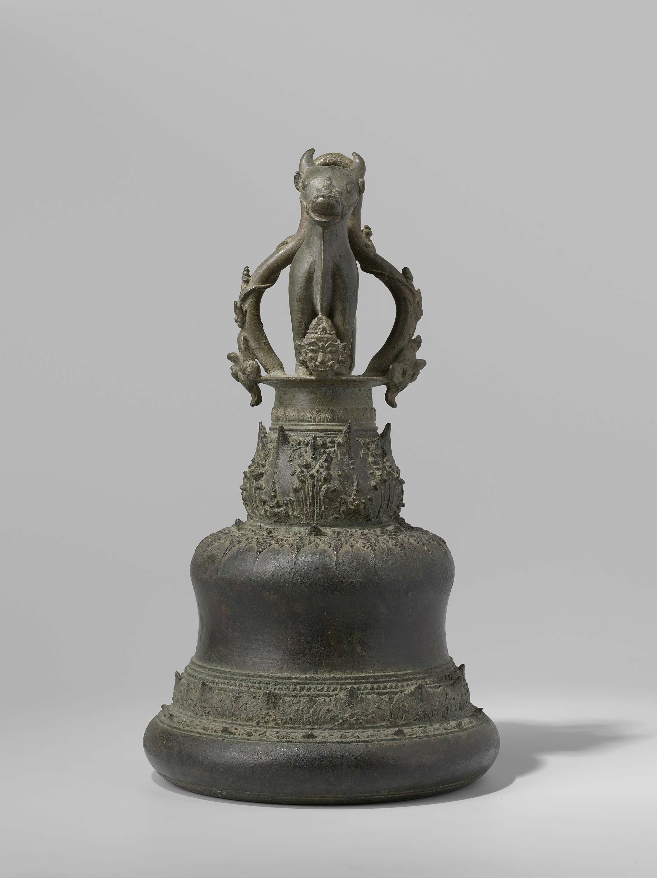 Bronze bell featuring a bull on top, associated with Shiva, by an unknown artist