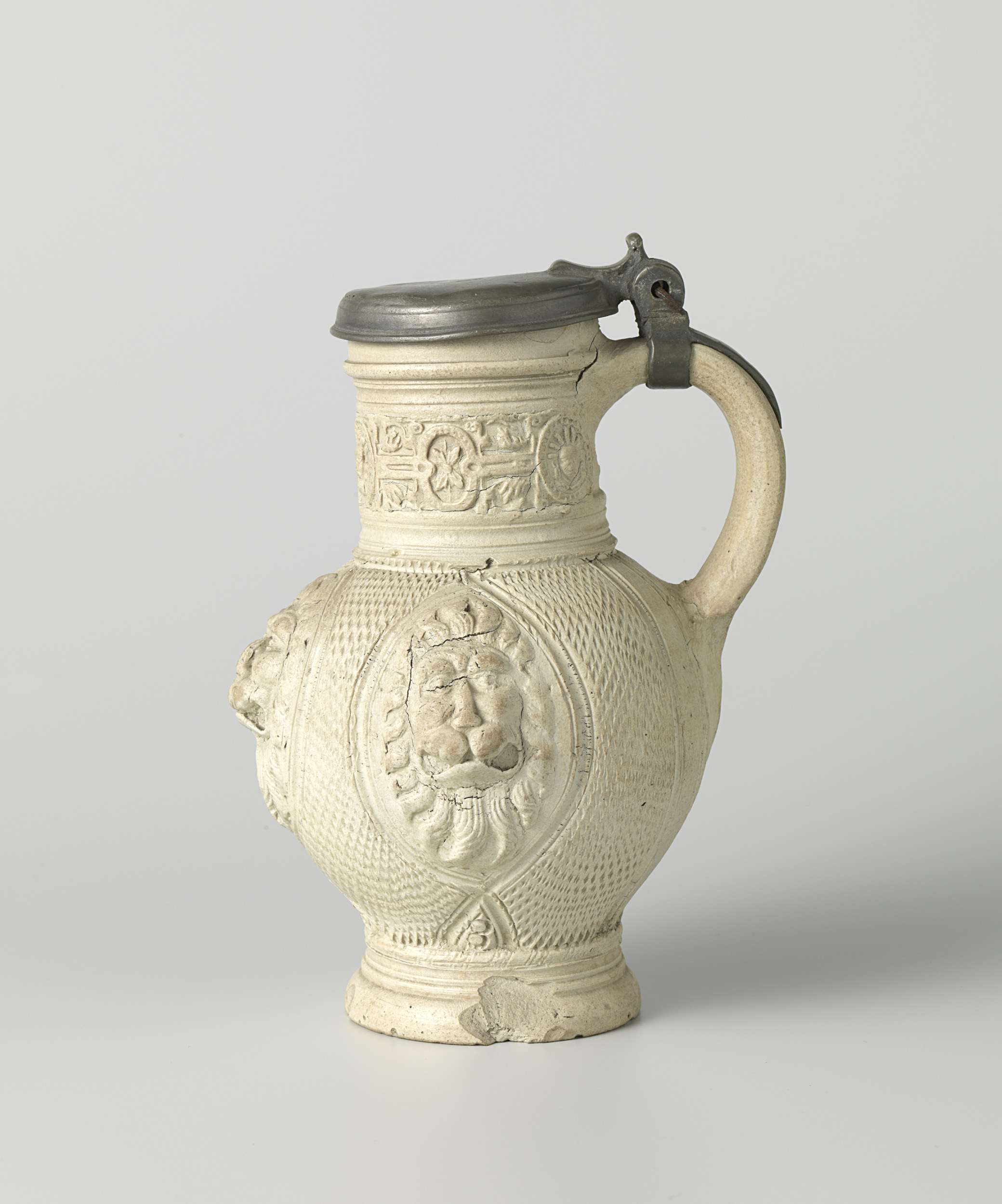 Ceramic jug with three lion heads and masks by unknown artist
