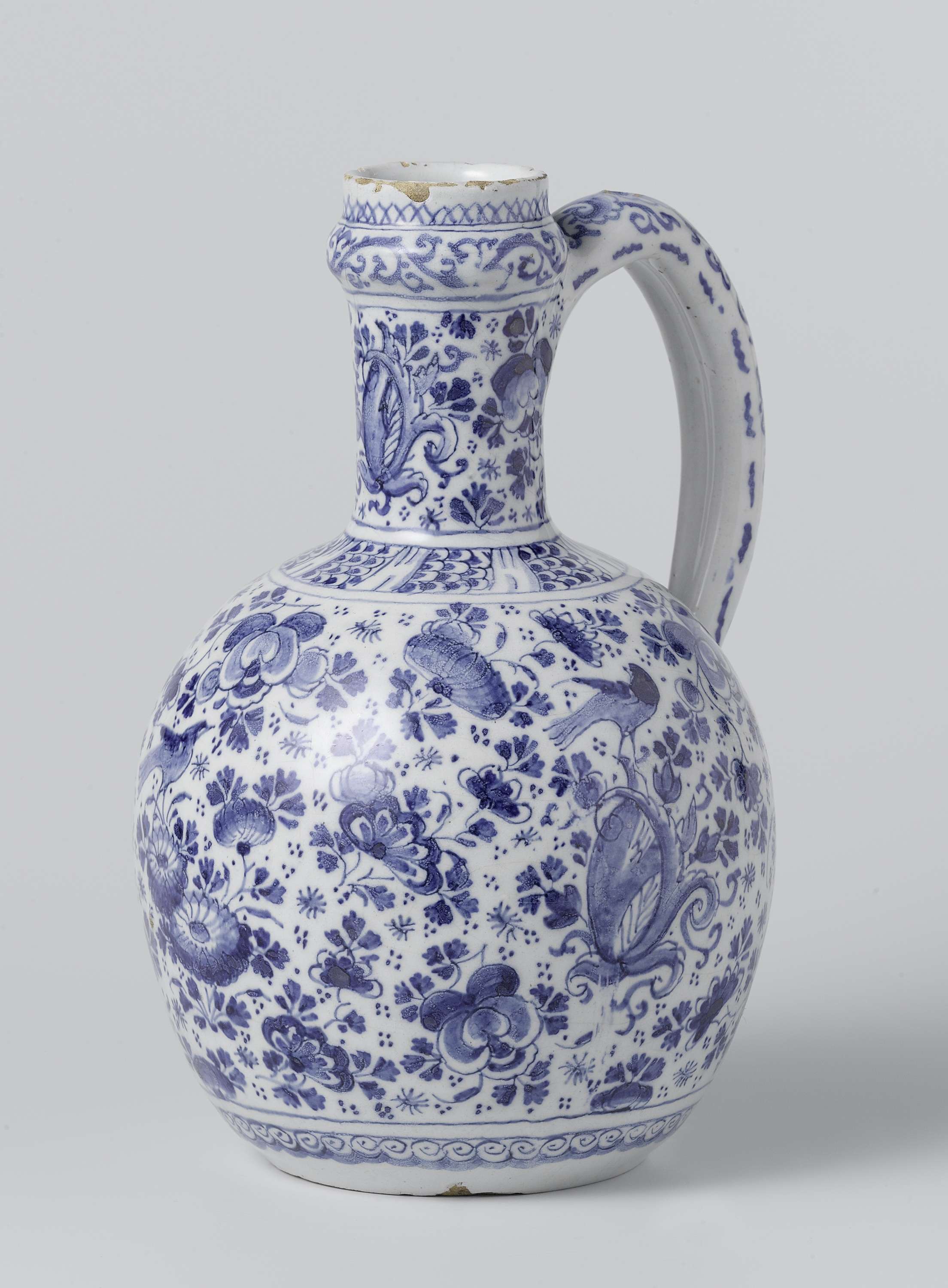 Jug by De Drie Posteleyne Astonne, earthenware, highlighting intricate patterns and light.