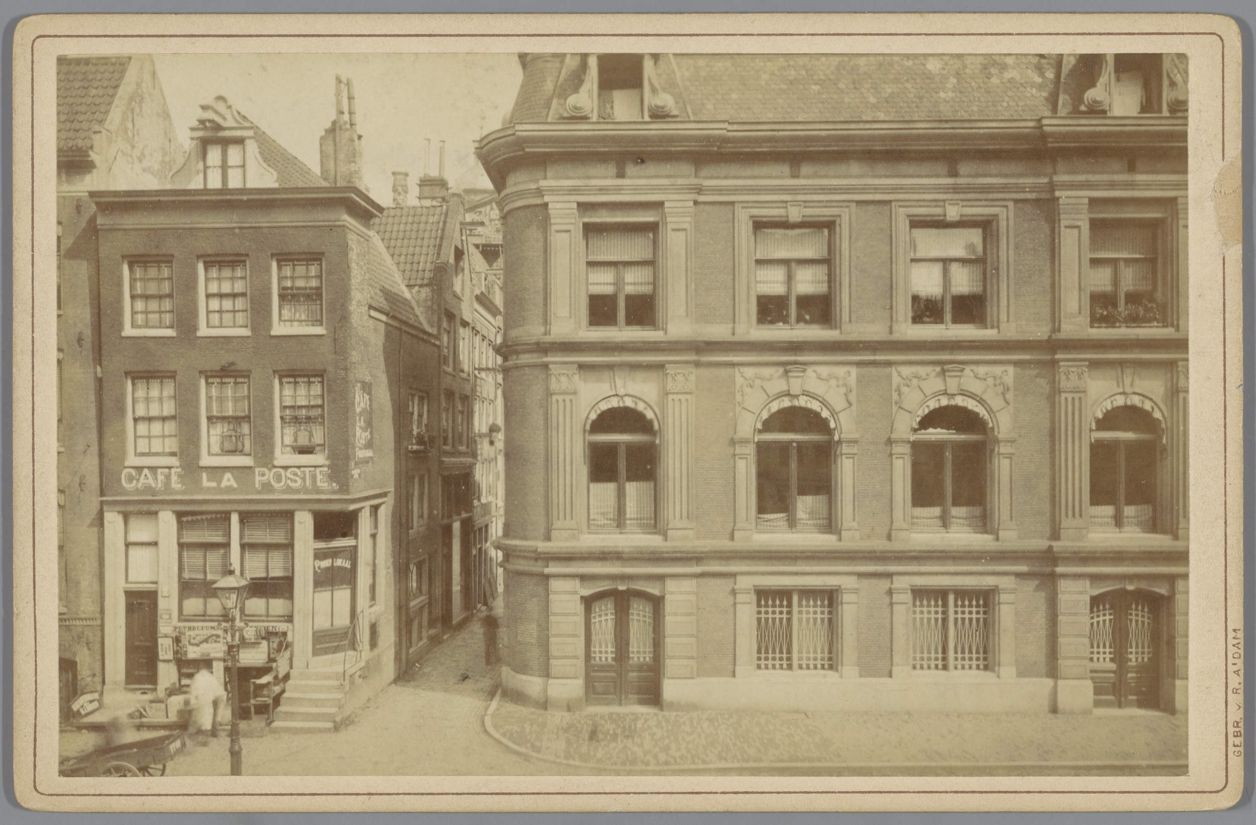 Albumen print by Gebr. van R. showing a quaint Amsterdam building under a cloudy sky.
