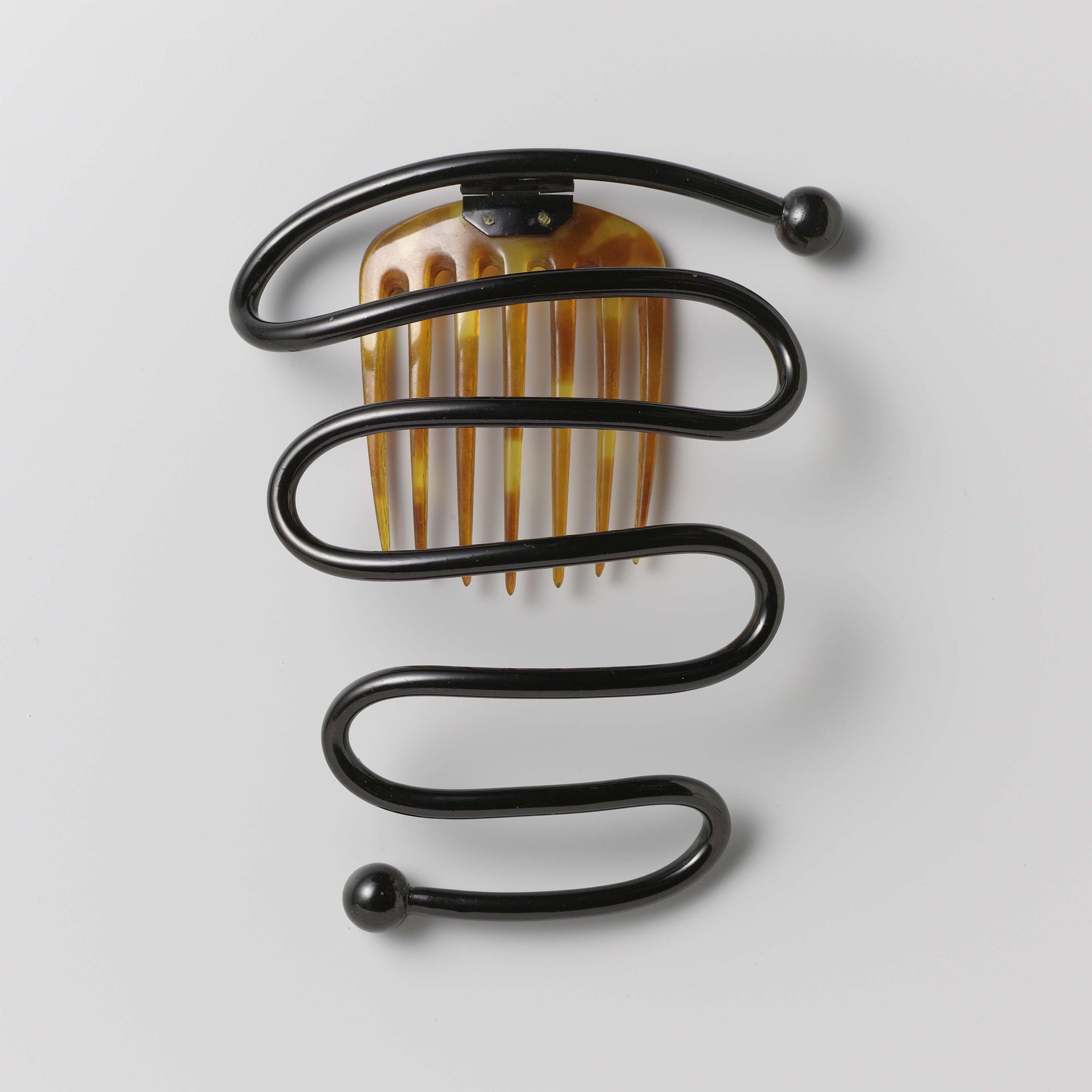Victorian decorative hair comb with snake motif by Unknown Artist