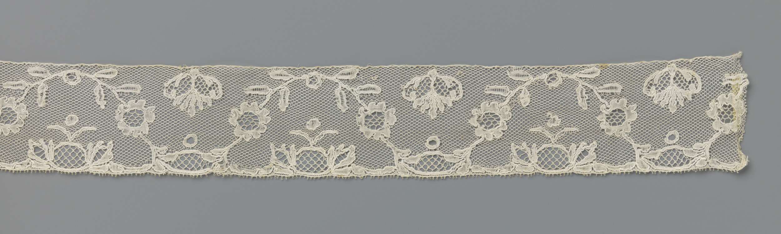 Lace work featuring floral motifs by Unknown Artist