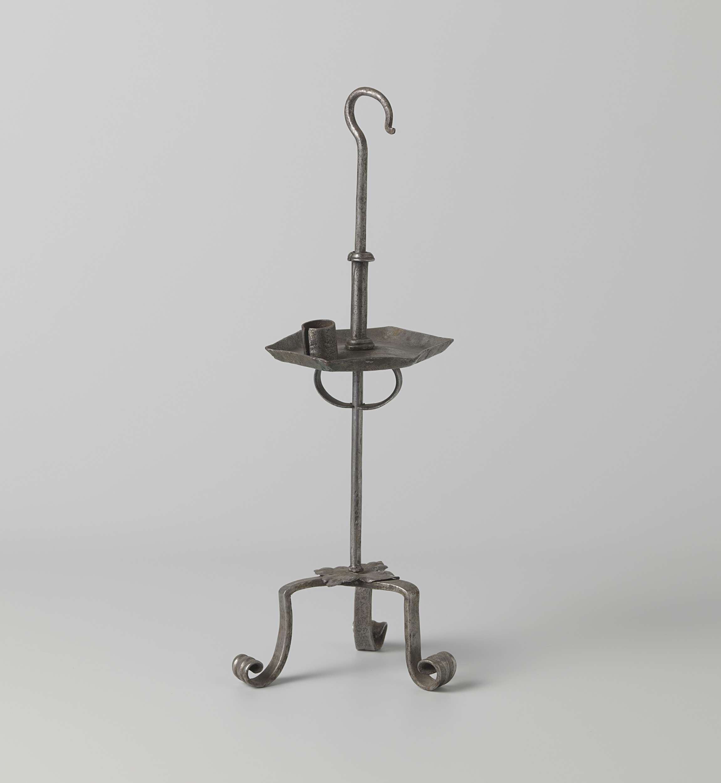 Candlestick made of metal with intricate engravings by Unknown Artist