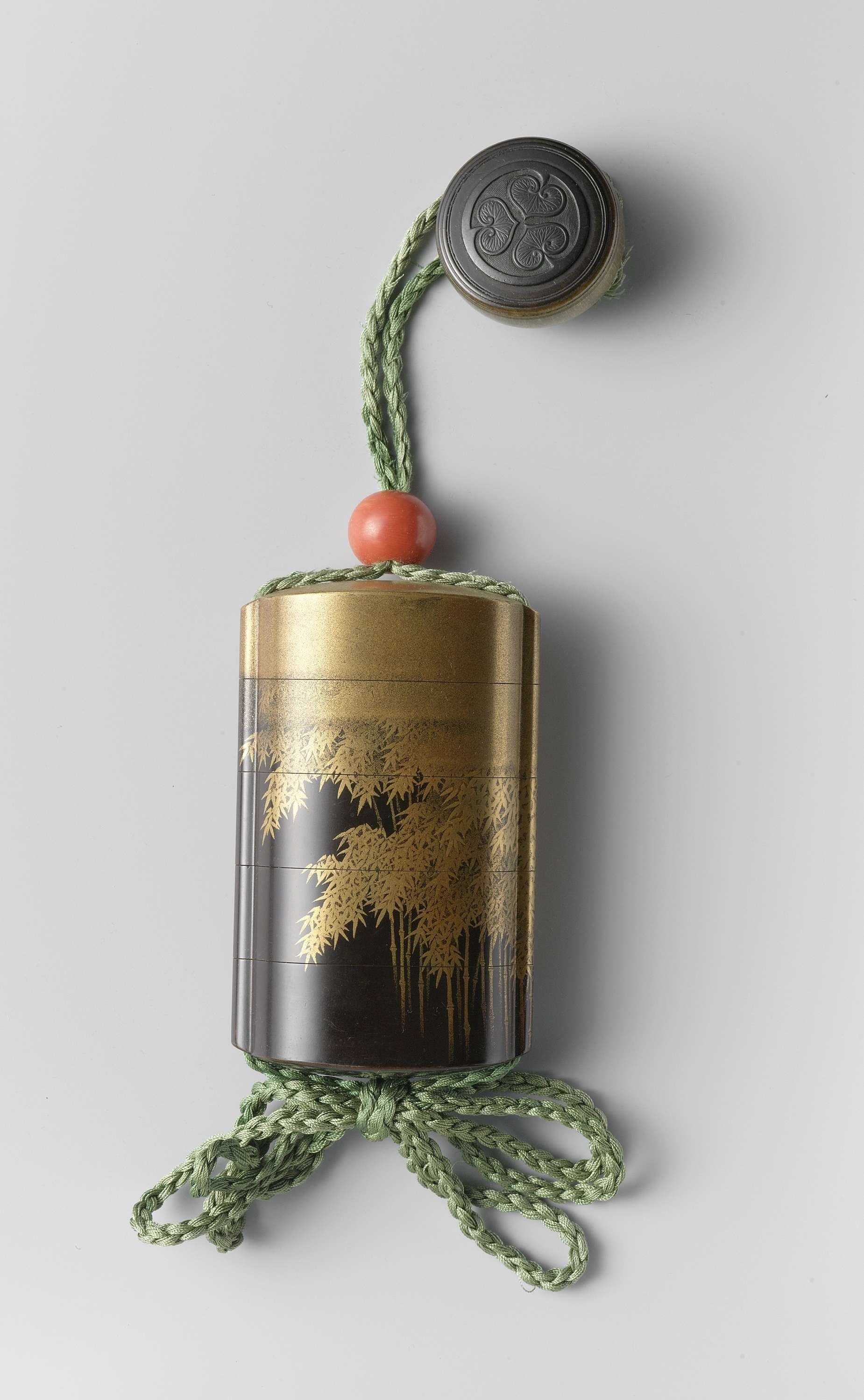 Inro by Shiomi Masanari, wood medium, showcasing intricate lacquer details.