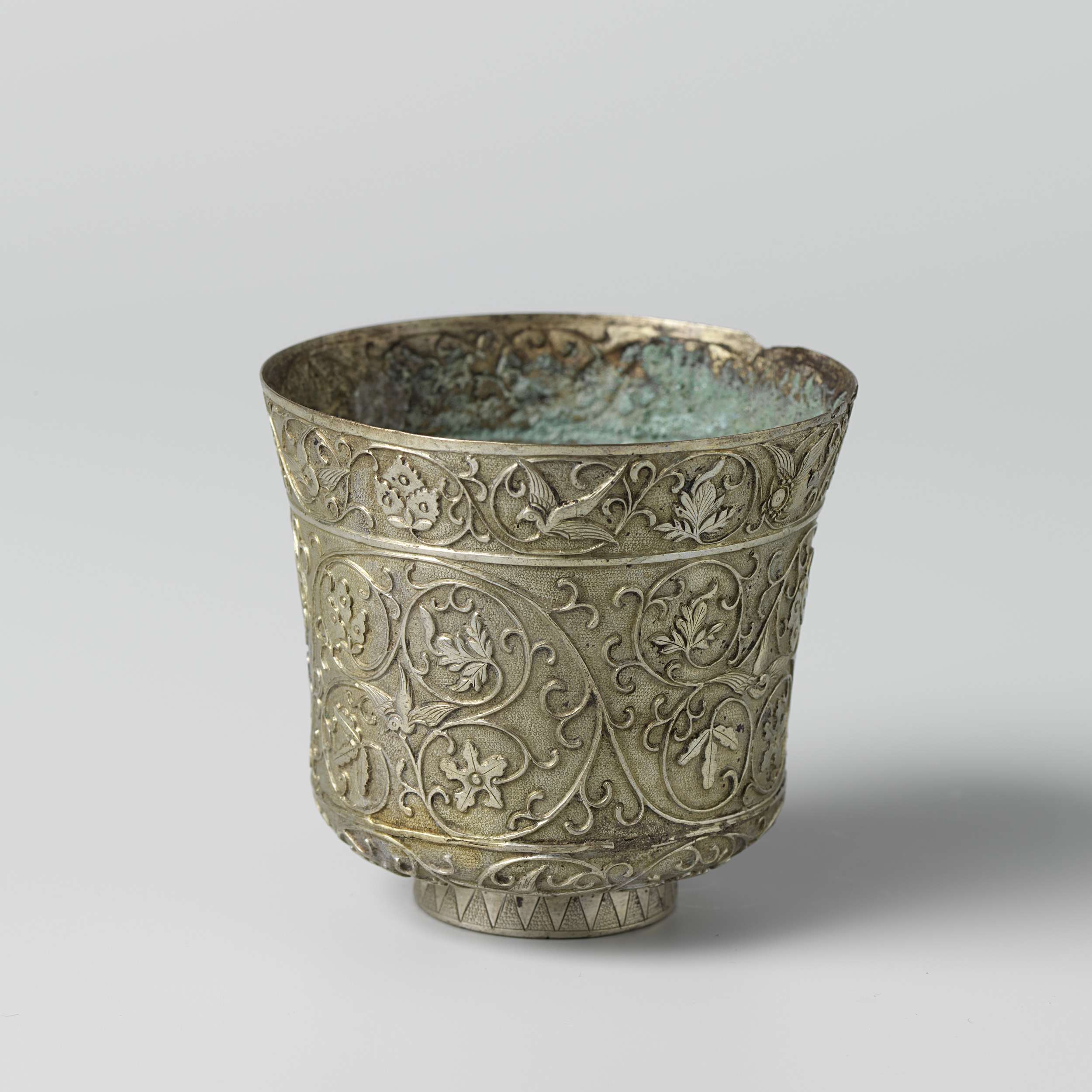 Ceramic cup with intricate patterns by Unknown Artist