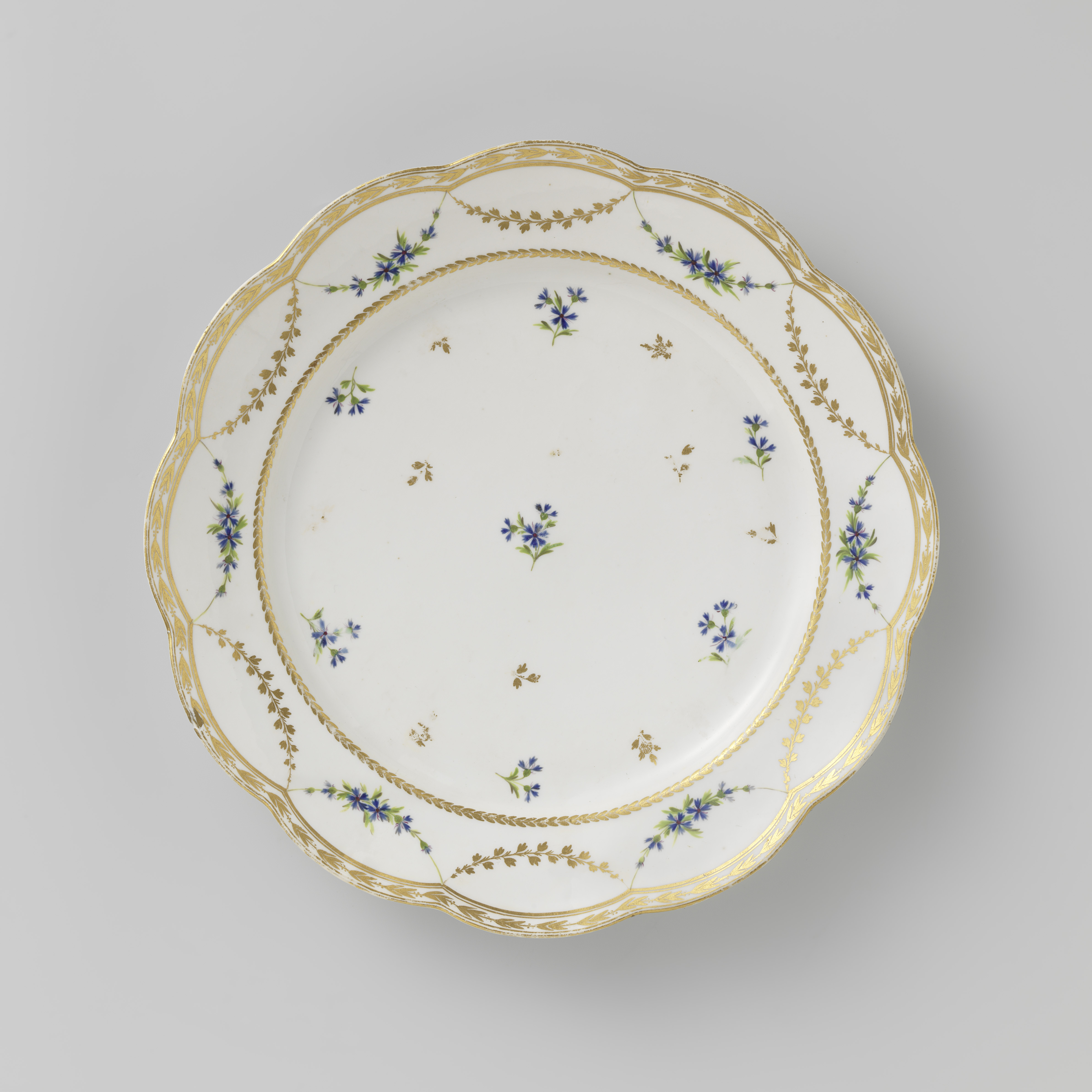 Porcelain plate by Manufacture Oud-Loosdrecht with intricate floral motifs.