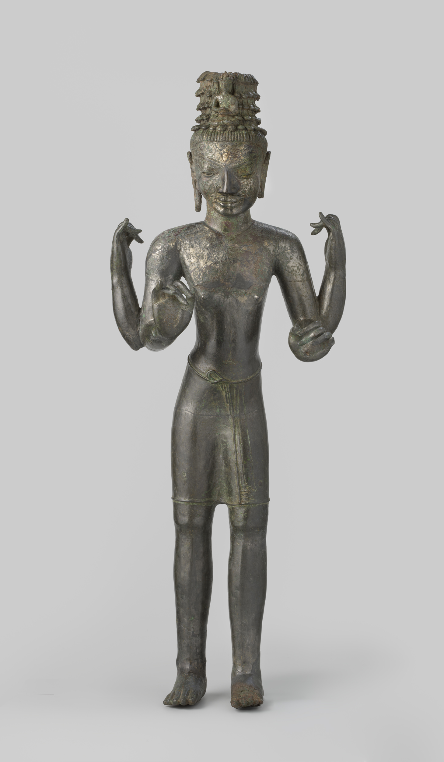 Avalokiteshvara bronze statue by Unknown Artist with Buddha Amitabha in the hairstyle.