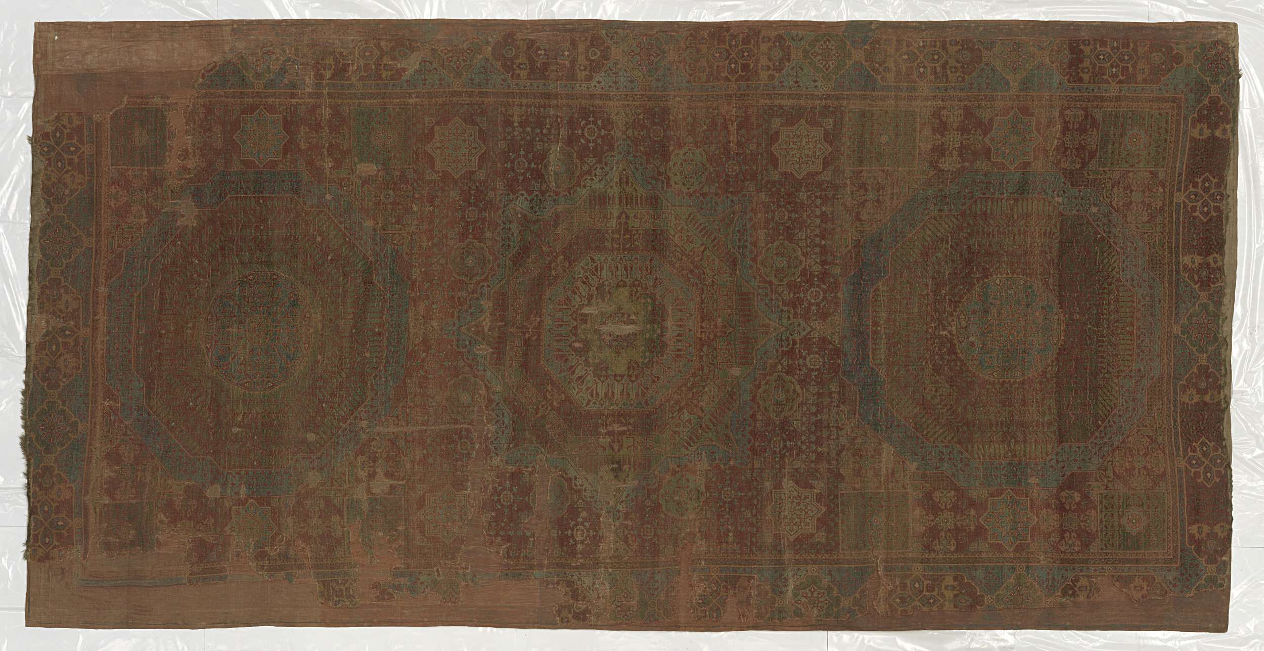 Wool tapestry by Unknown Artist featuring intricate floral patterns.