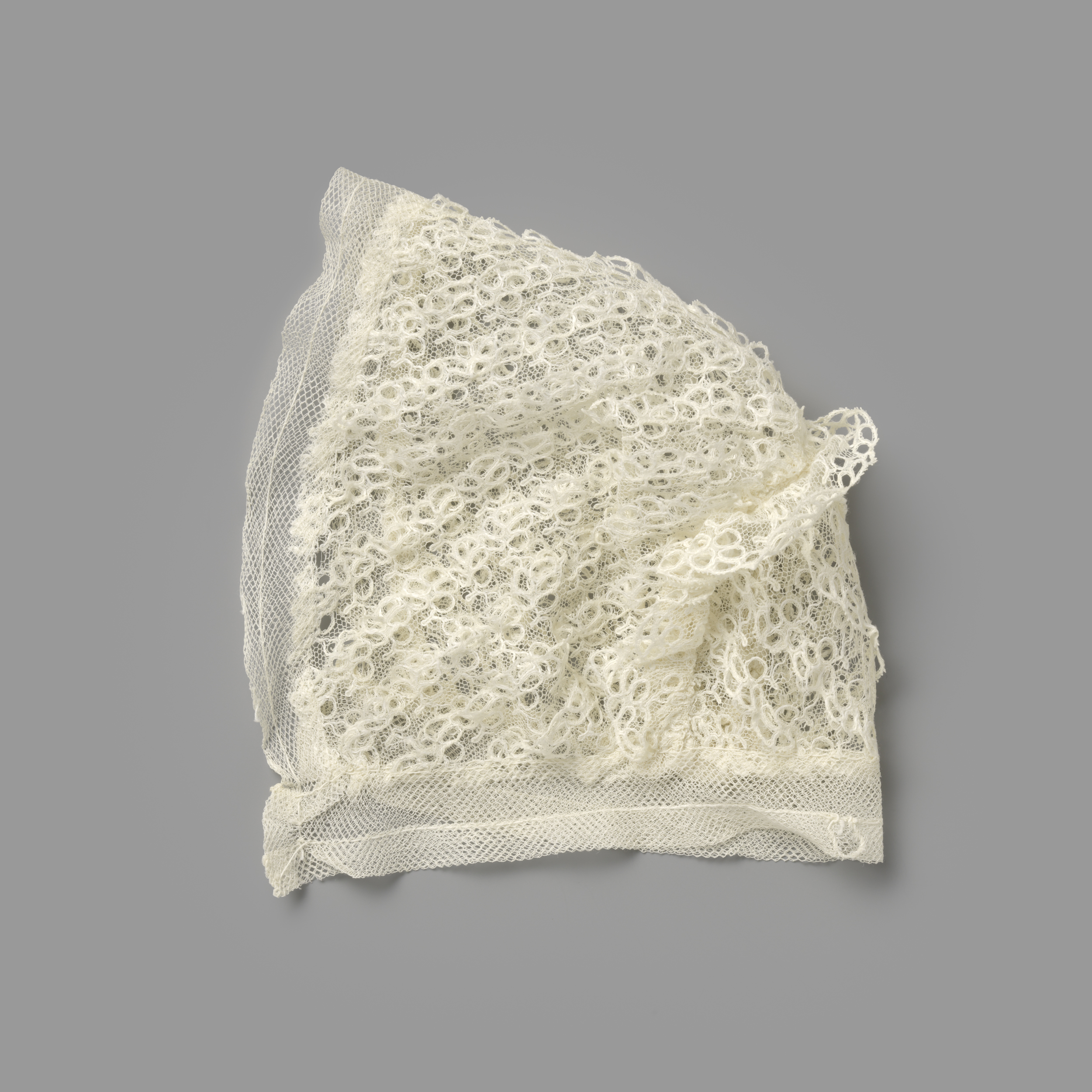 Victorian textile headwear made of white tulle by Unknown Artist