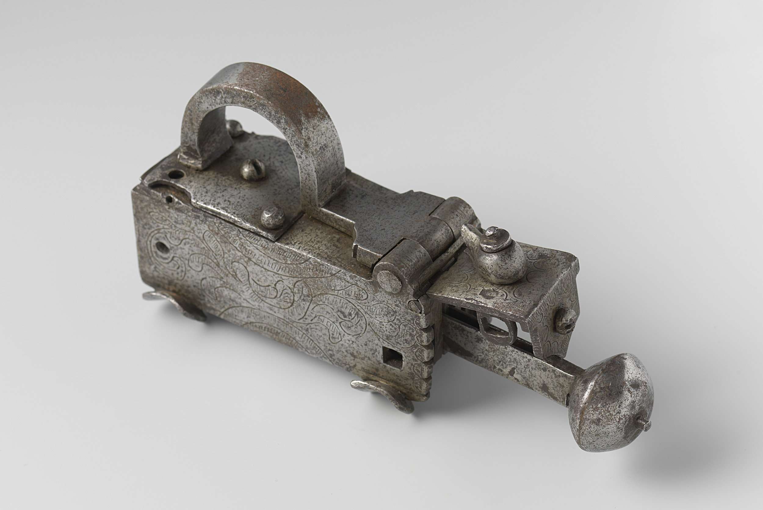 Oblong padlock in bronze by unknown artist, symbolizing security and vulnerability.