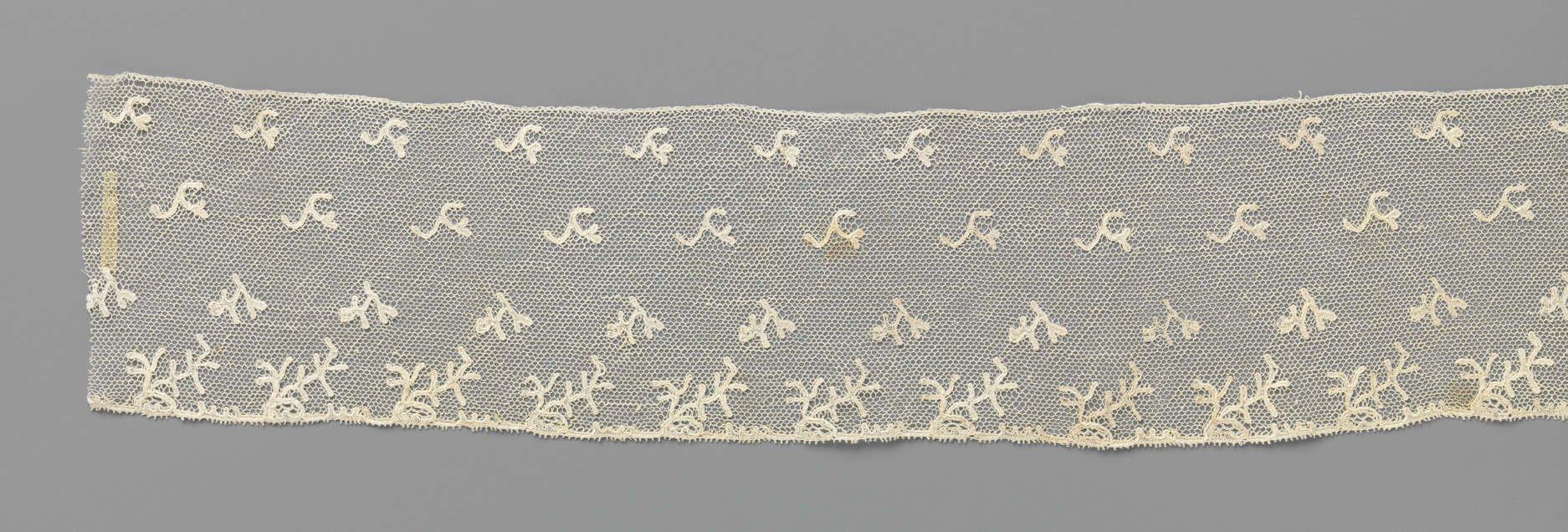 Delicate lace textile featuring V-shaped twig patterns by Unknown Artist.