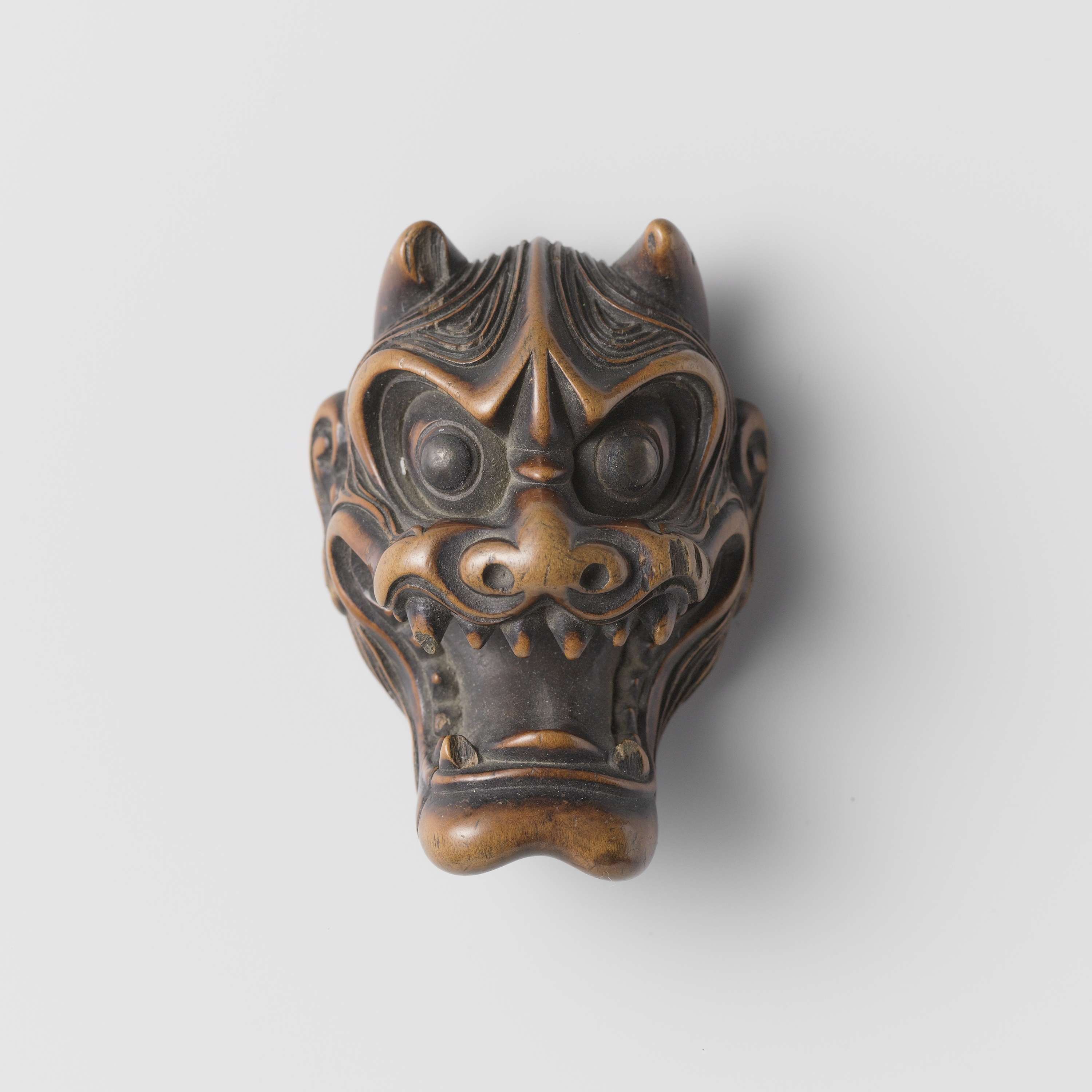 Three carved netsuke made of wood by an unknown artist