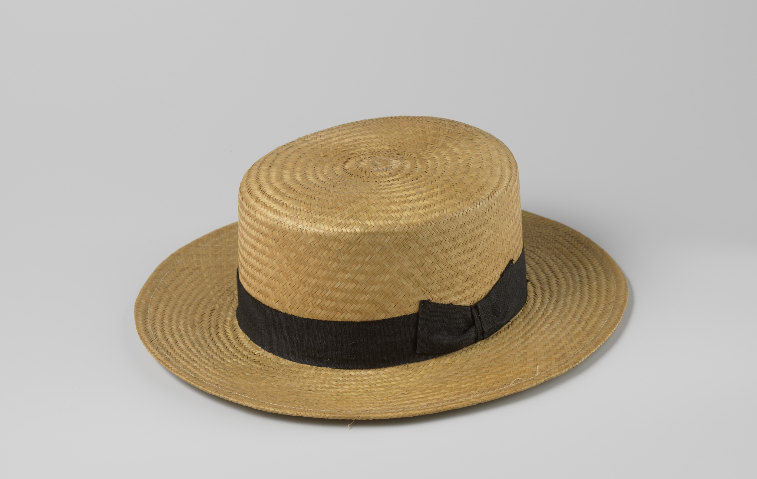 Still life of a straw hat with a black ribbon by Unknown Artist