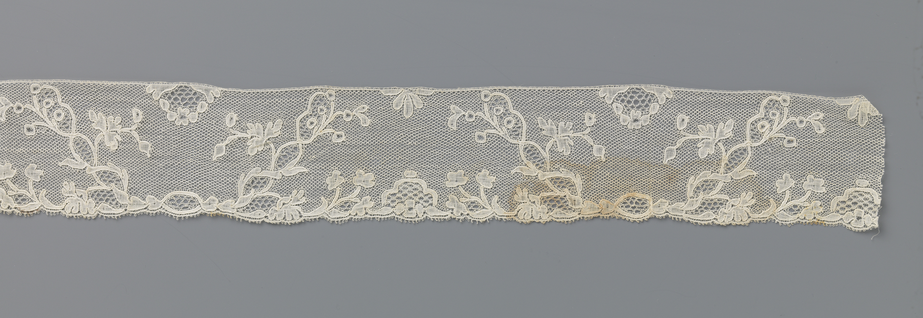 Lace artwork by Unknown Artist featuring trapezium-shaped fields.