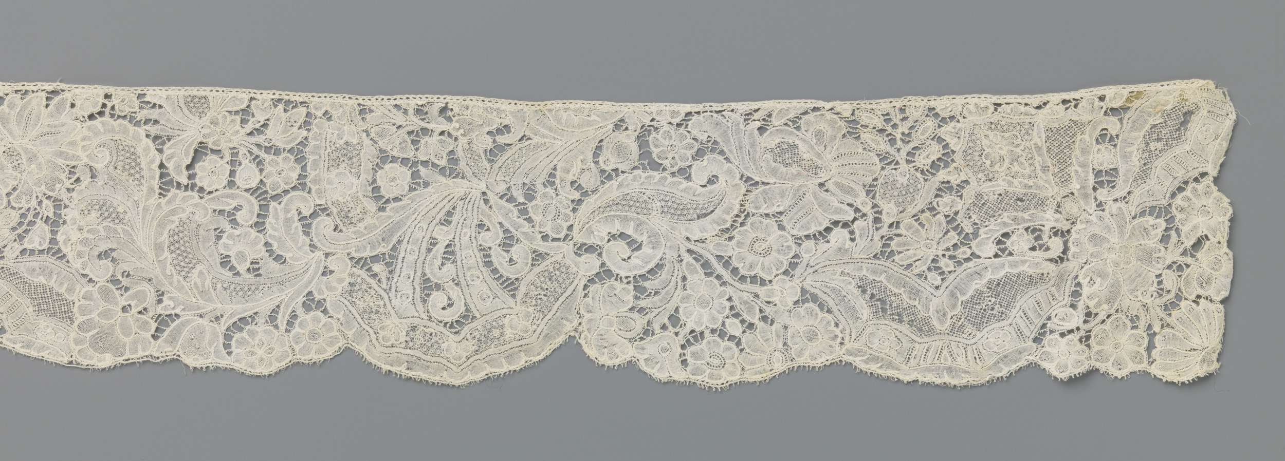 Lace work featuring scalloped edges and intricate embroidery by Unknown Artist