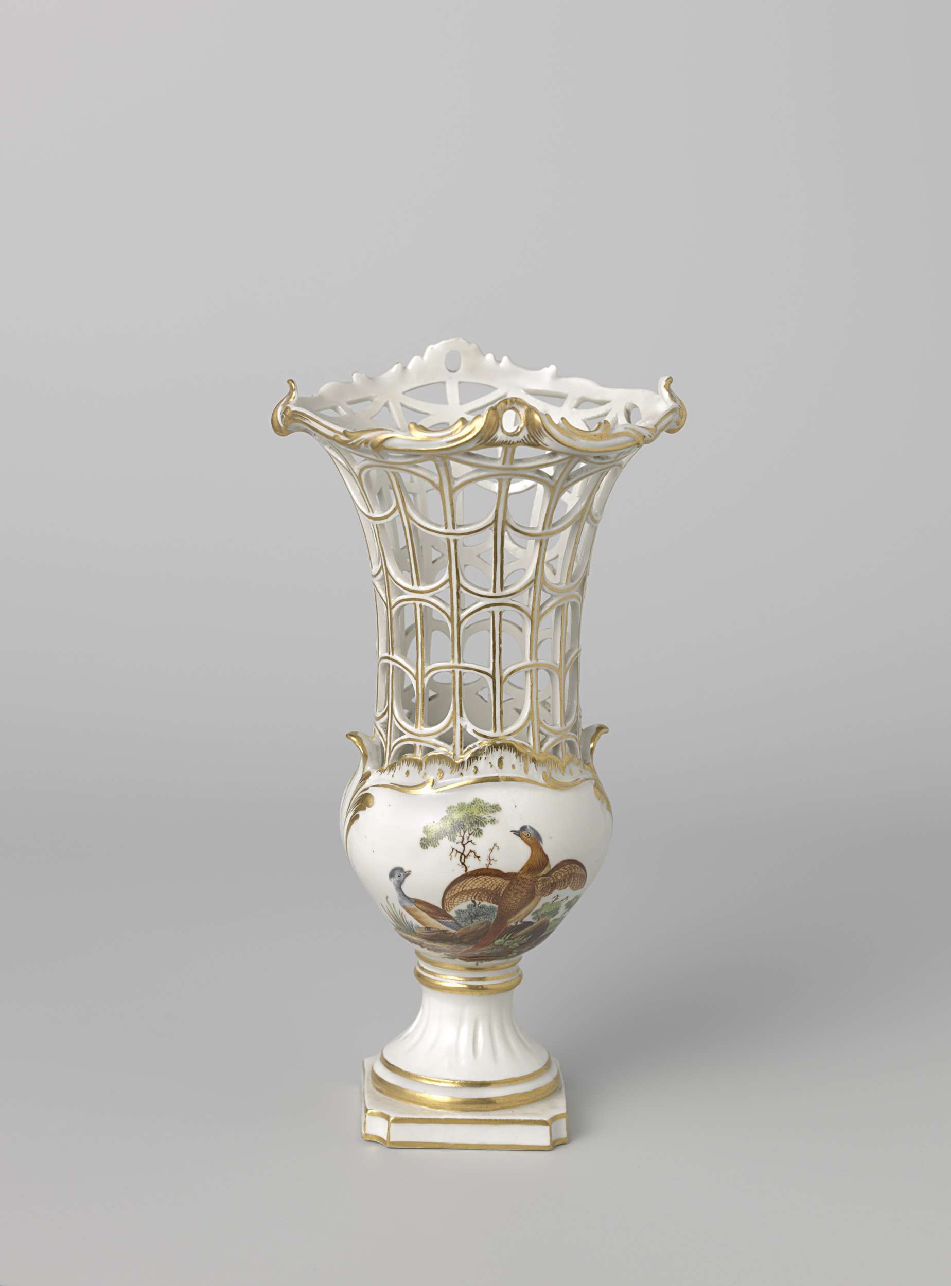 Porcelain vase by Manufacture Oud-Loosdrecht with intricate pastel designs.