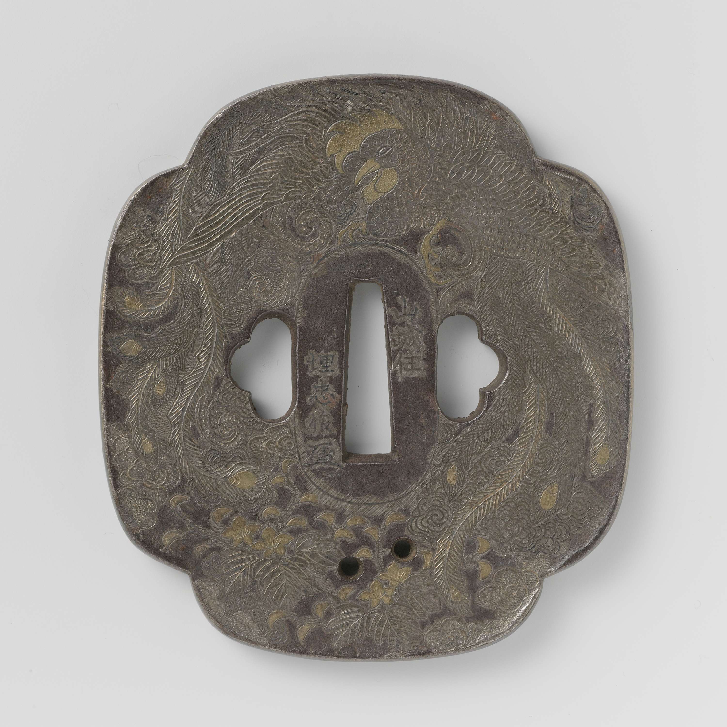 Hand guard by Umetada, a metalwork piece with intricate patterns.